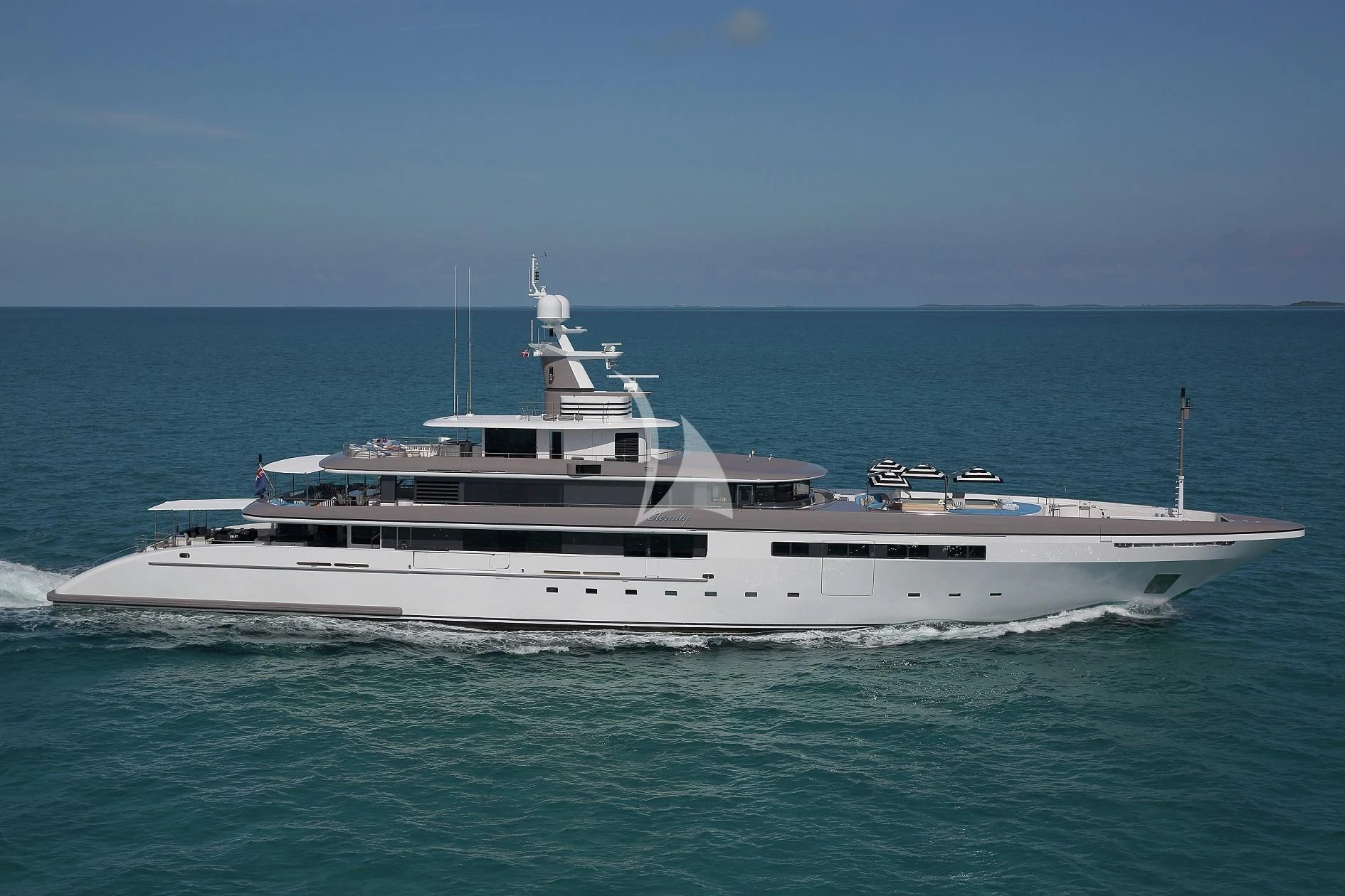 a white boat in the water aboard ETERNITY Yacht for Sale