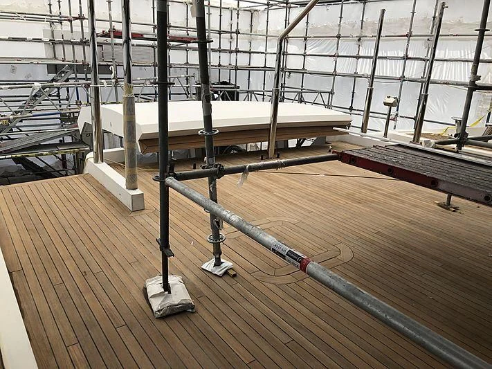 a large warehouse with large metal beams aboard ETERNITY Yacht for Sale
