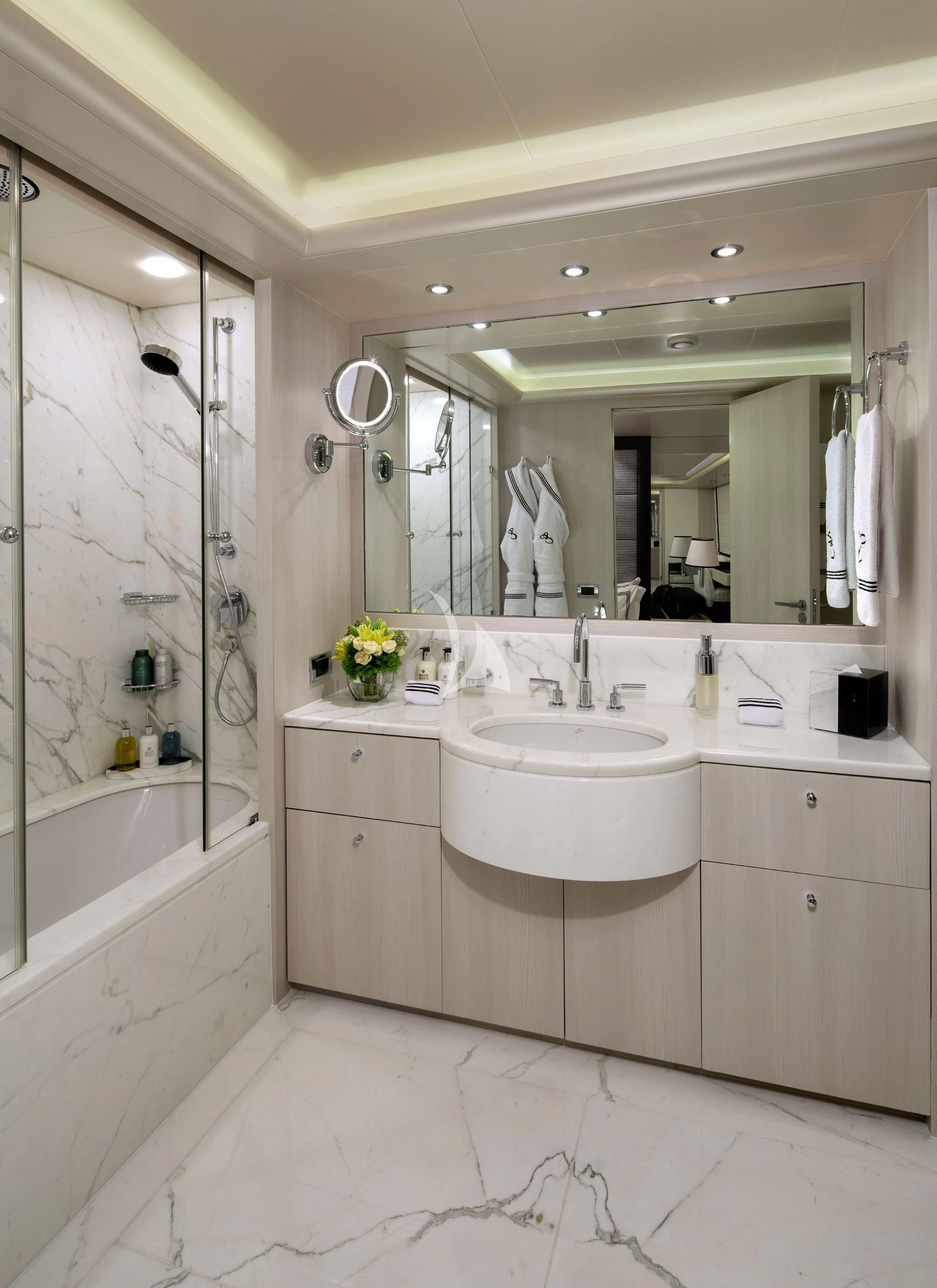 a bathroom with a large mirror aboard ETERNITY Yacht for Sale