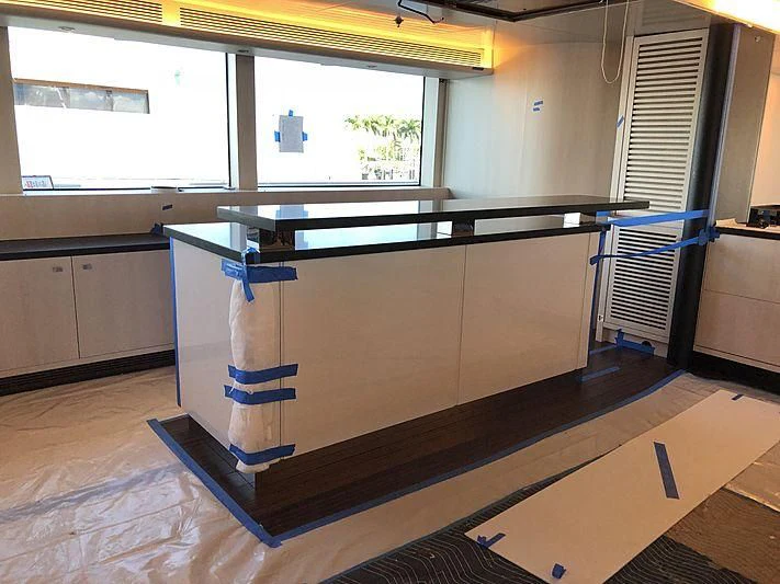 a large kitchen with a large island aboard ETERNITY Yacht for Sale