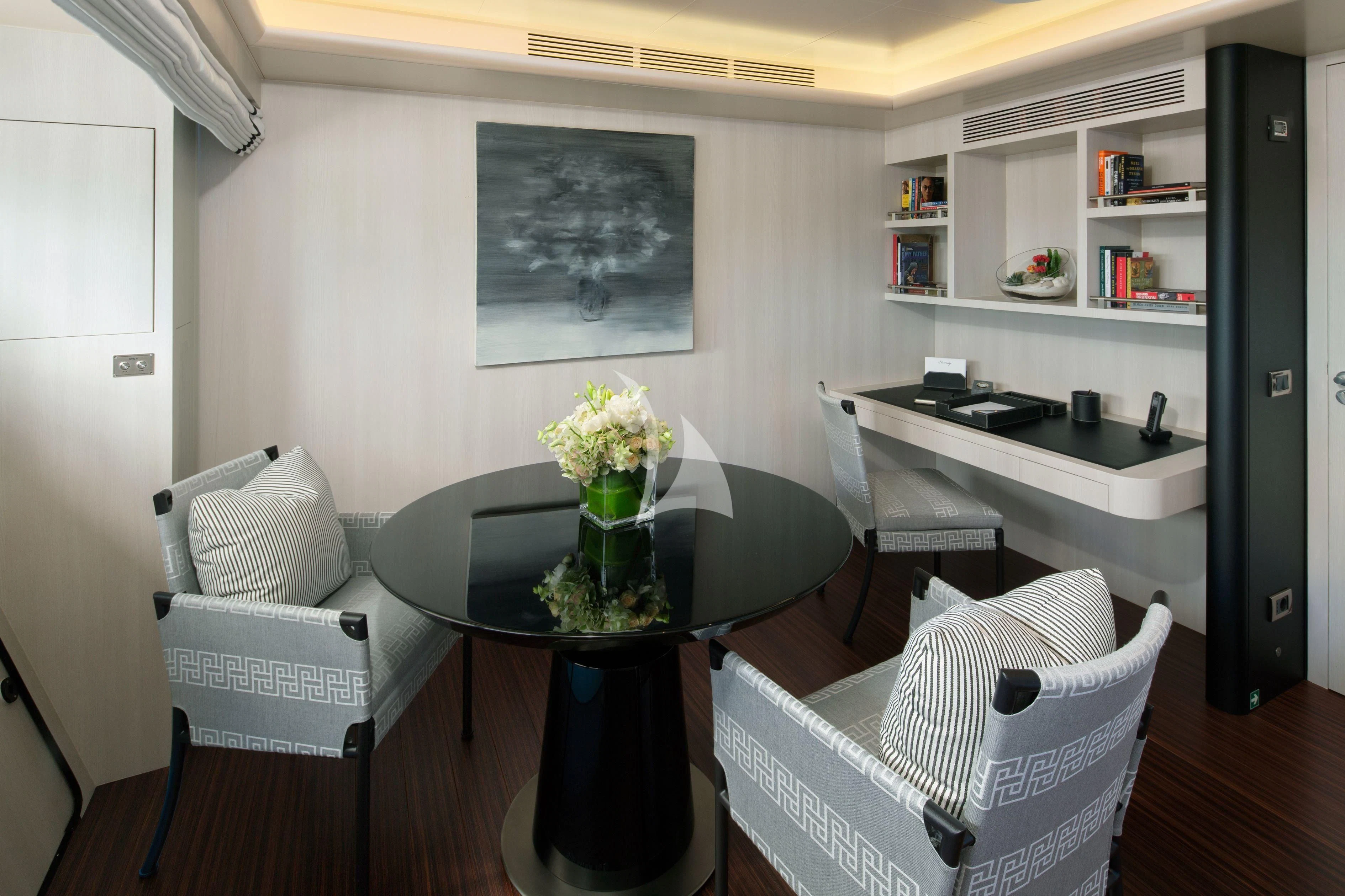 a room with a table and chairs aboard ETERNITY Yacht for Sale