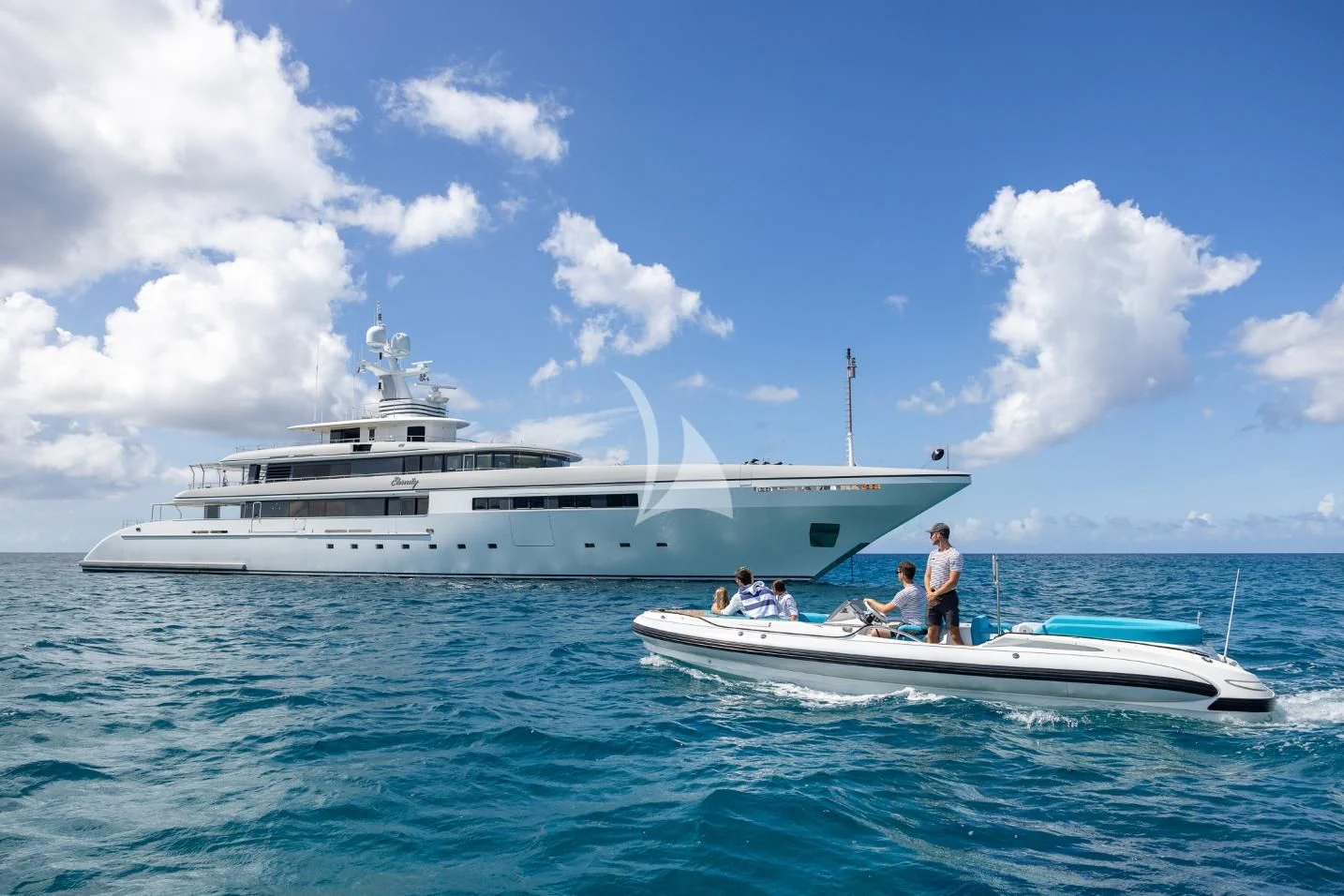 a group of people on a boat in the water aboard ETERNITY Yacht for Sale