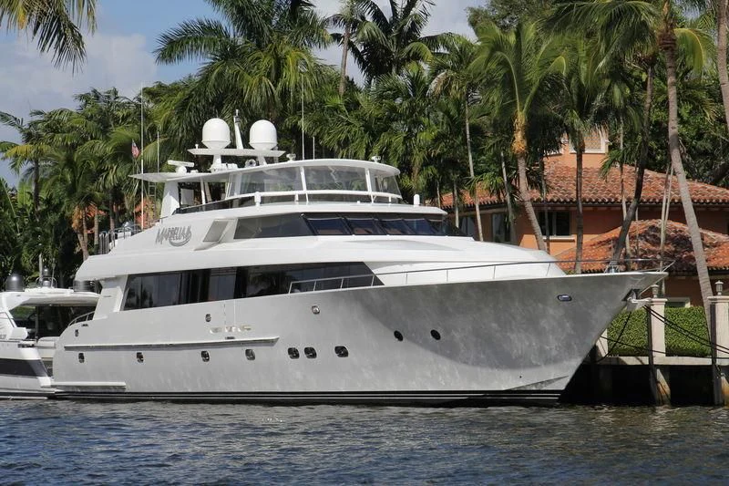 a white yacht in a tropical setting aboard MARBELLA II Yacht for Sale