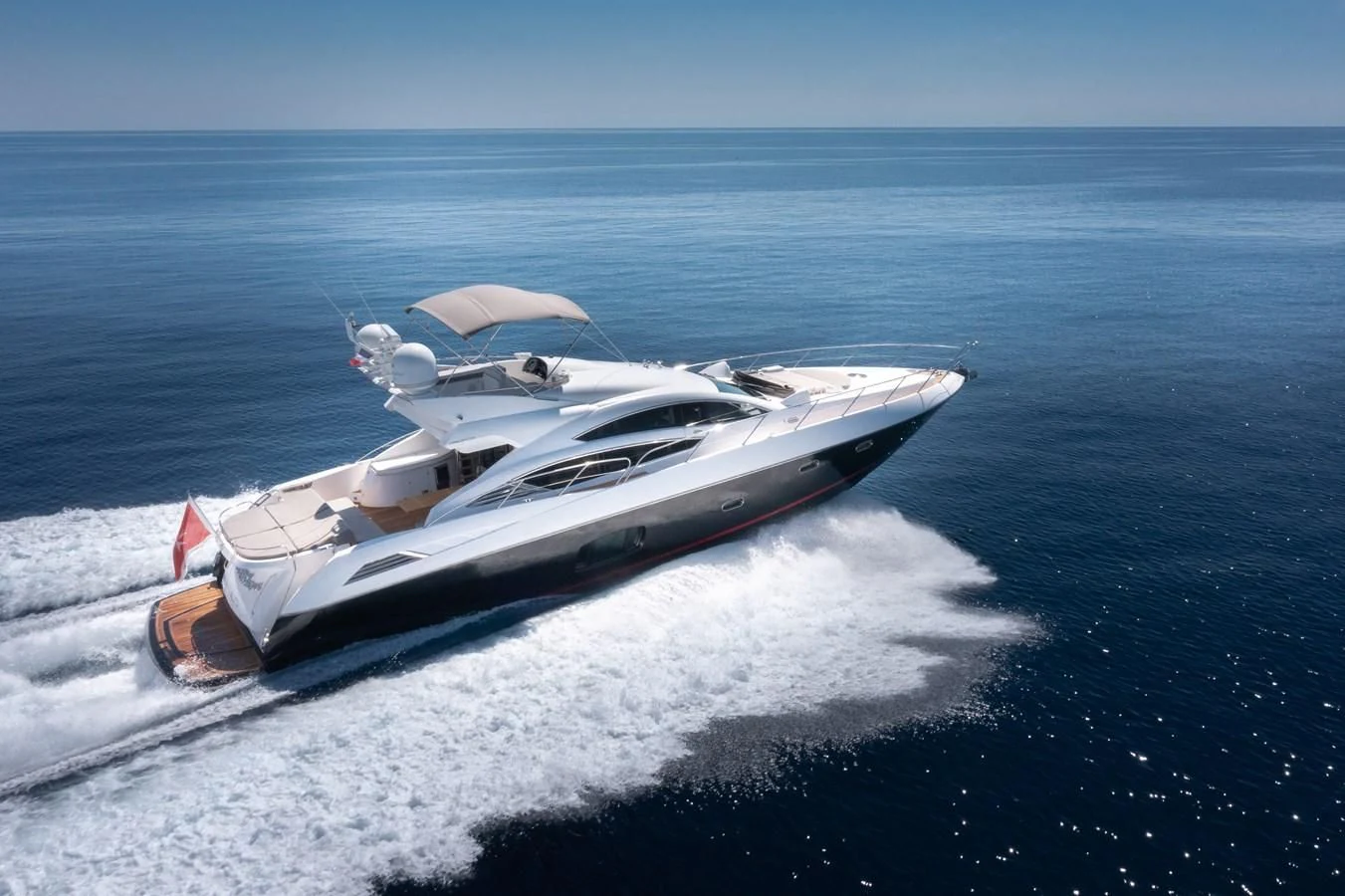 a white yacht on the water aboard STAR OF SEVEN SEAS Yacht for Sale