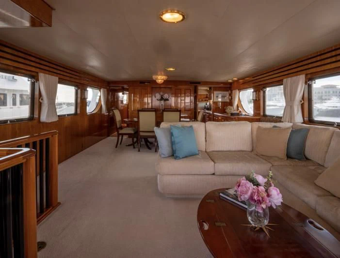 a living room with a couch and a coffee table aboard SEA CZAR Yacht for Sale