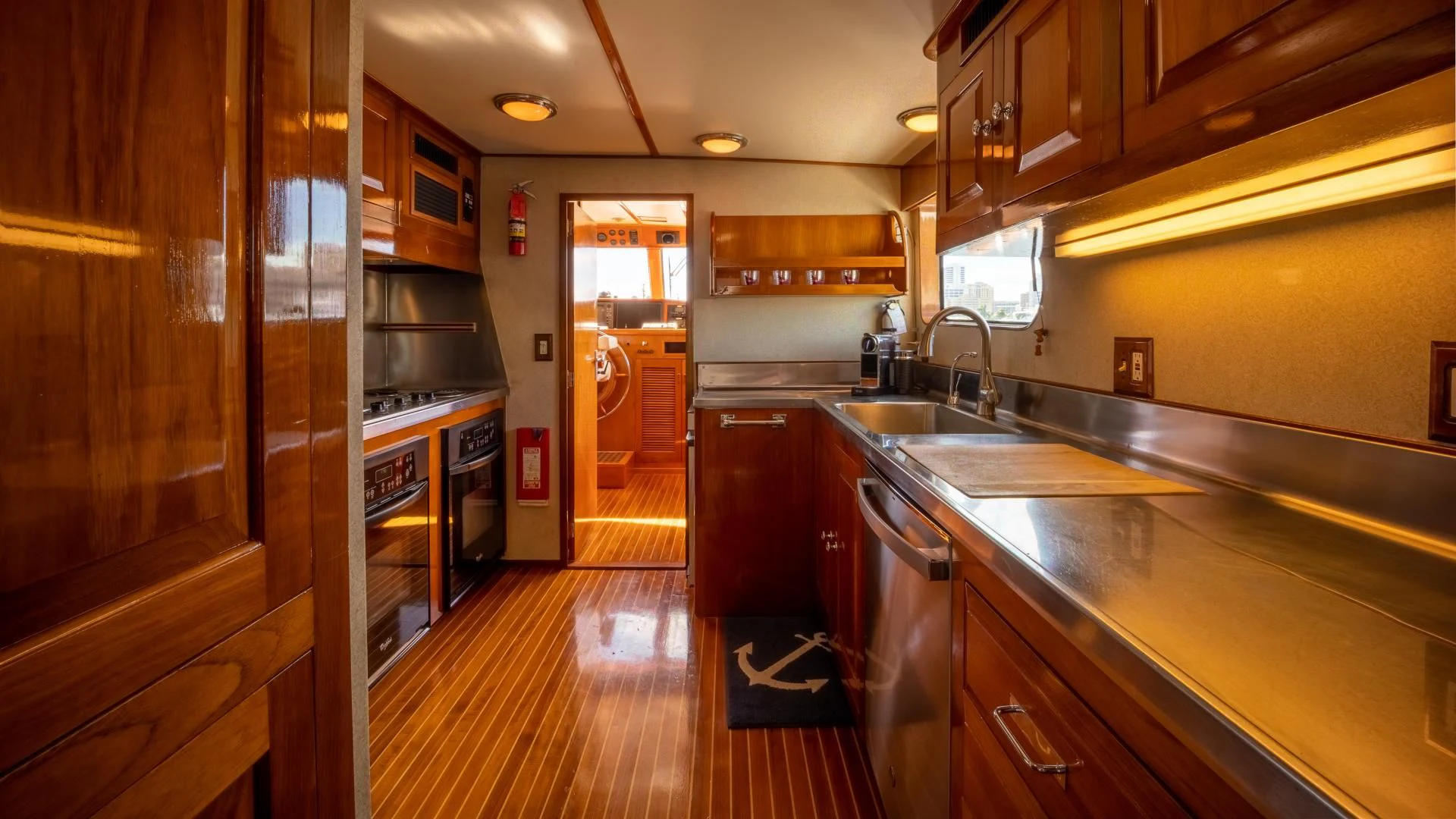 a kitchen with wooden cabinets aboard SEA CZAR Yacht for Sale
