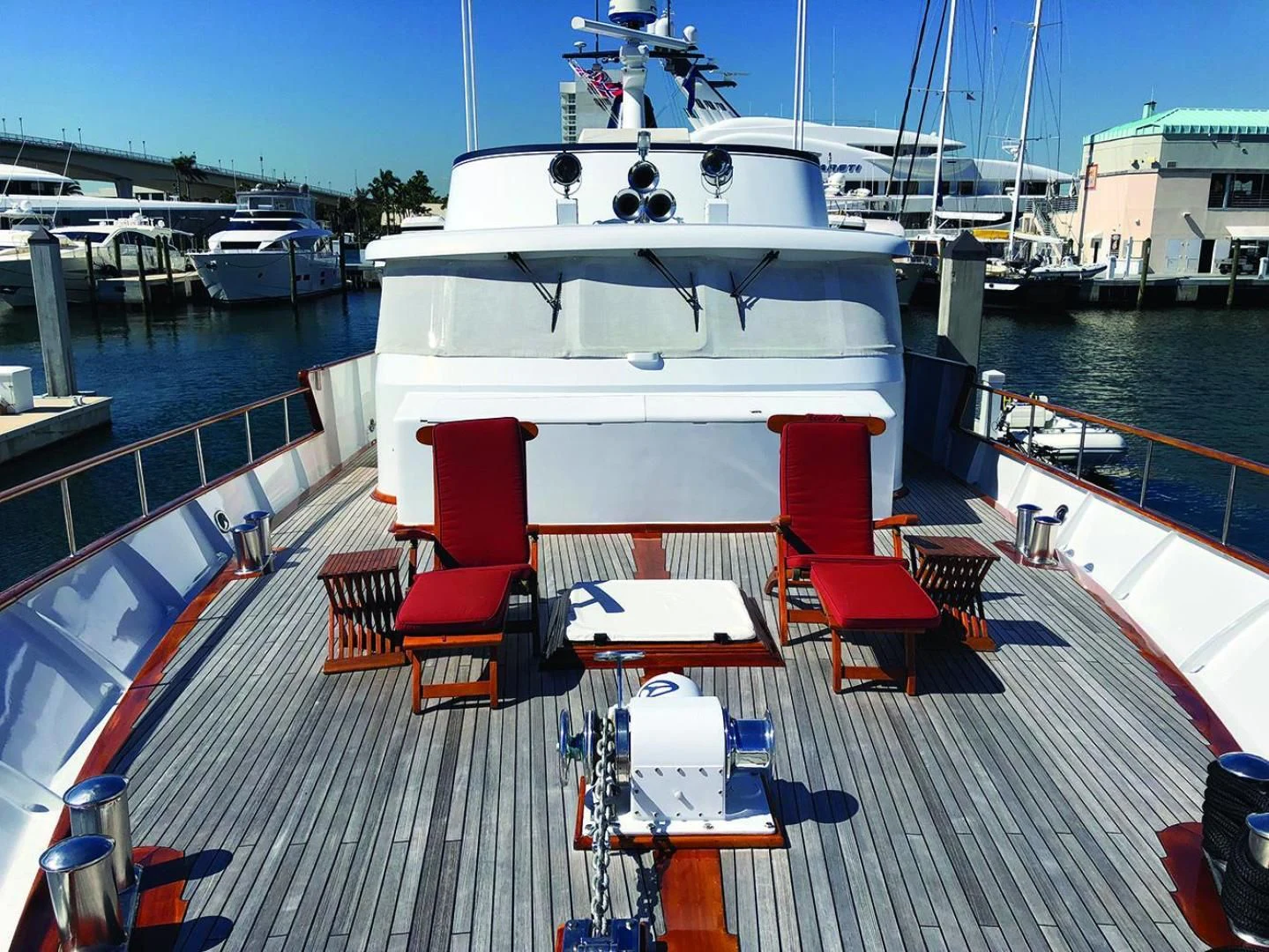a large white boat docked at a pier aboard SEA CZAR Yacht for Sale