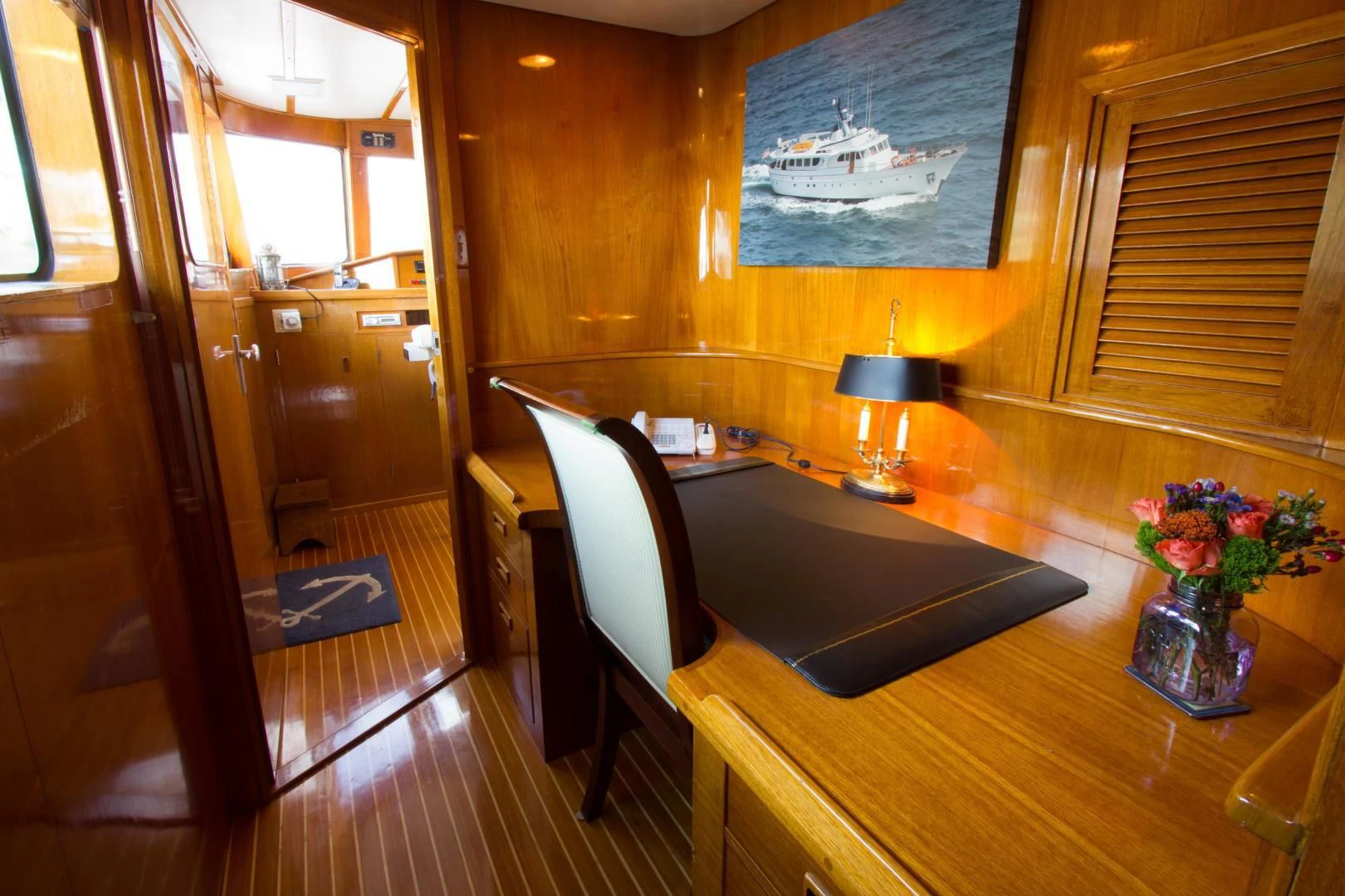 a room with a table and chairs aboard SEA CZAR Yacht for Sale