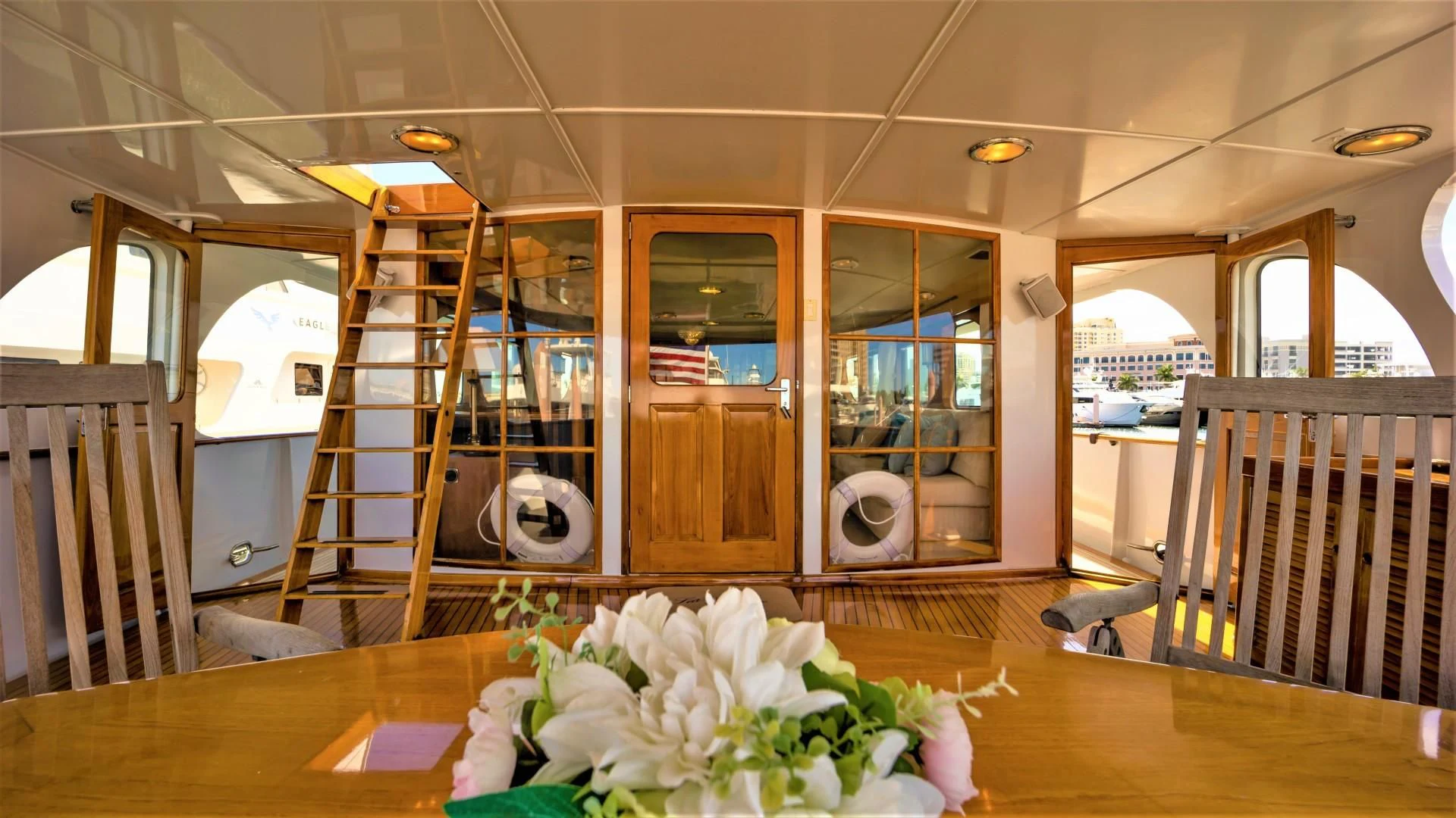 a room with a table and chairs aboard SEA CZAR Yacht for Sale