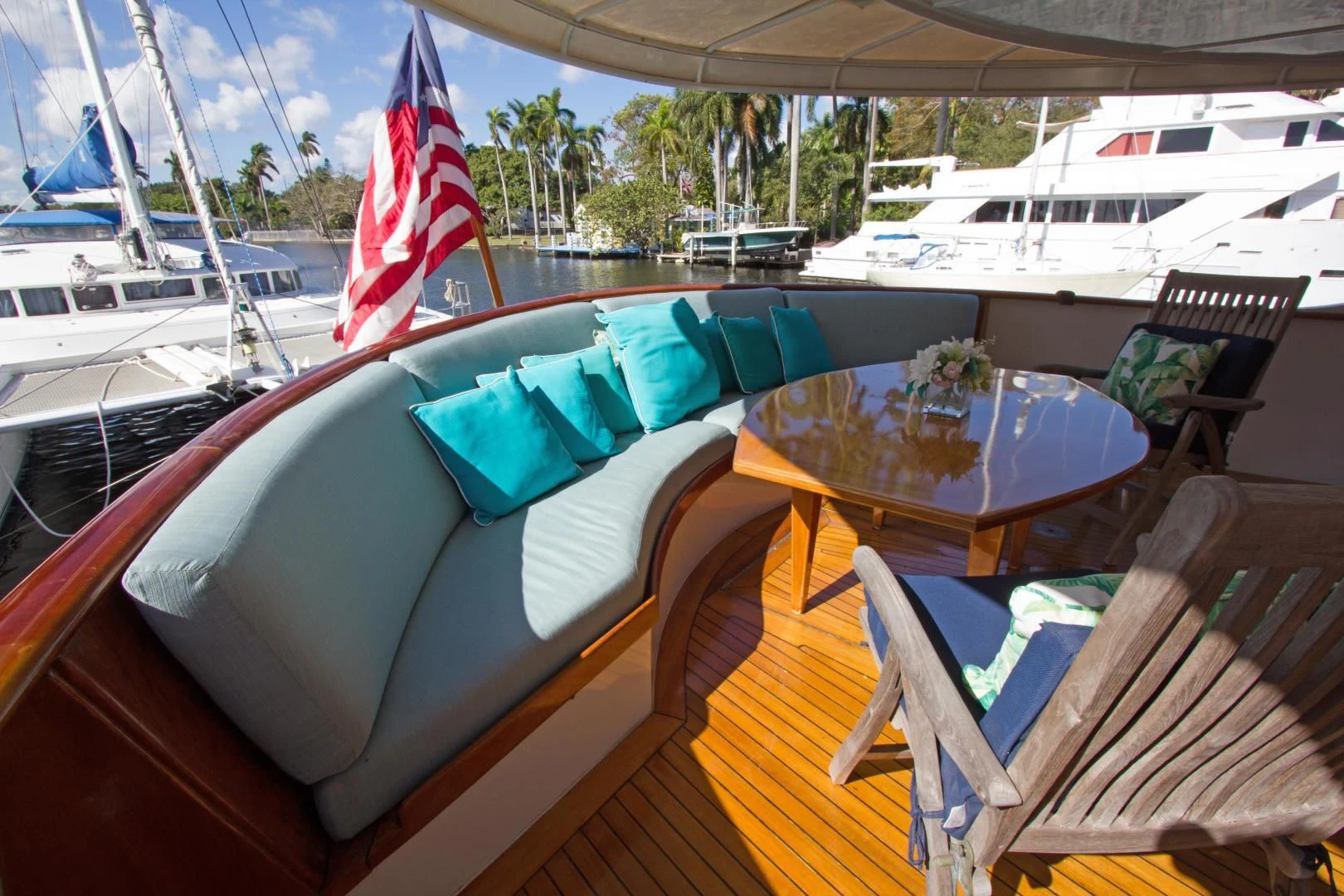 a boat with a table and chairs on the deck aboard SEA CZAR Yacht for Sale