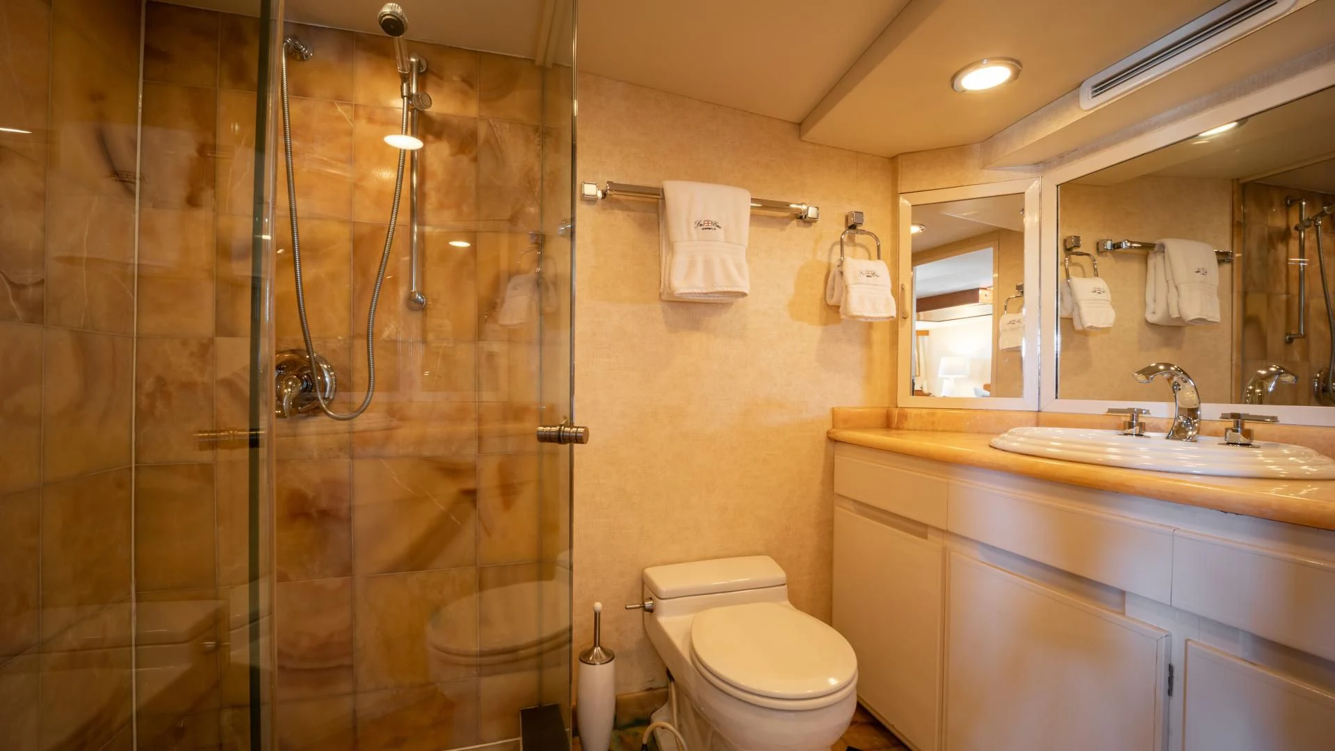 a bathroom with a glass shower aboard SEA CZAR Yacht for Sale