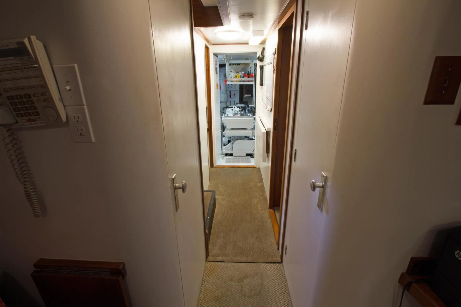 a hallway with a door and a mirror aboard SEA CZAR Yacht for Sale
