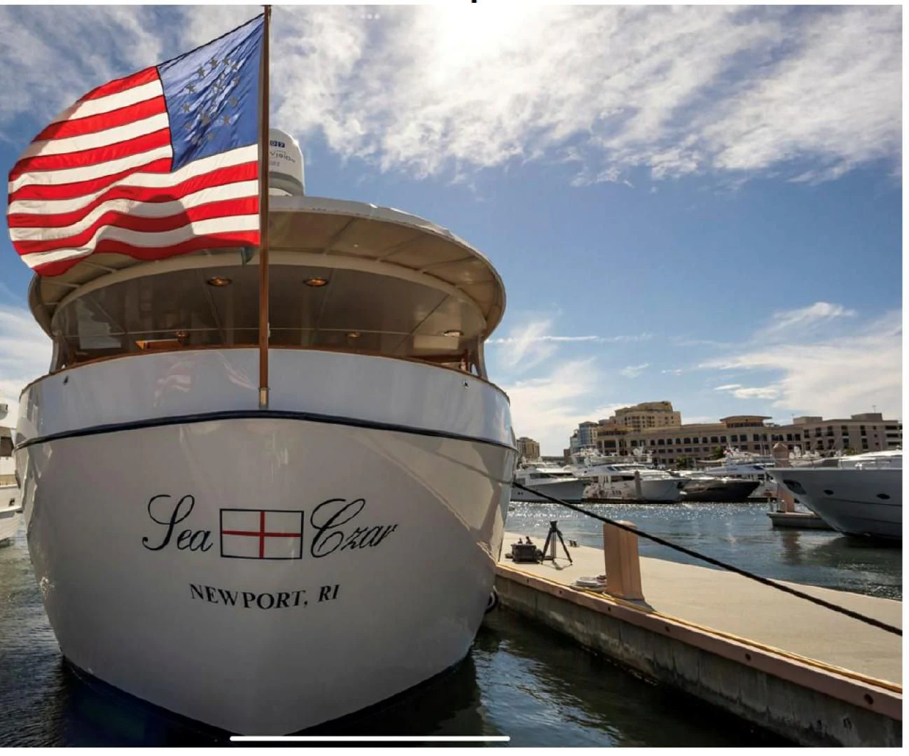 a large boat with a flag on it aboard SEA CZAR Yacht for Sale