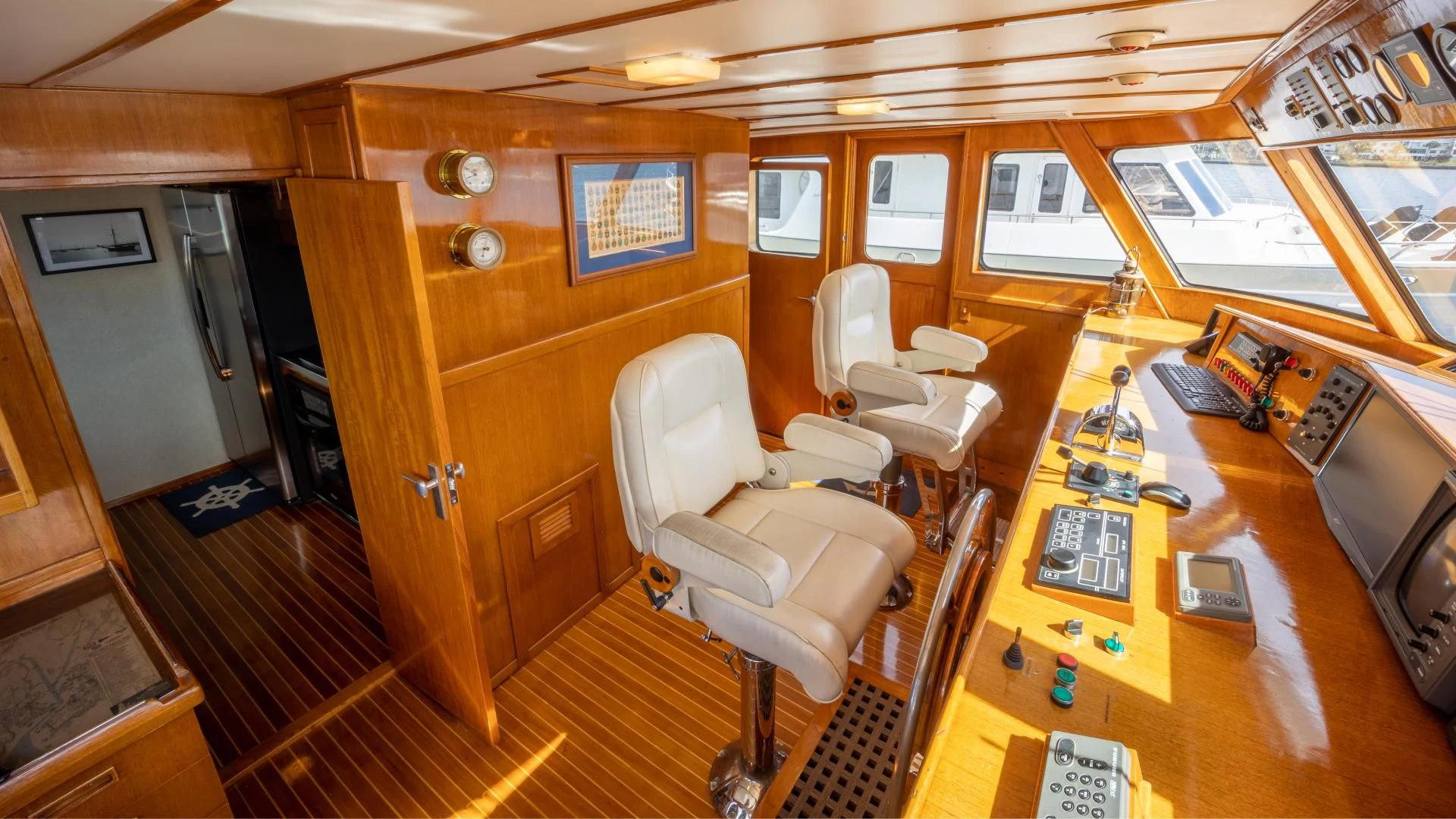 a room with a desk and chairs aboard SEA CZAR Yacht for Sale
