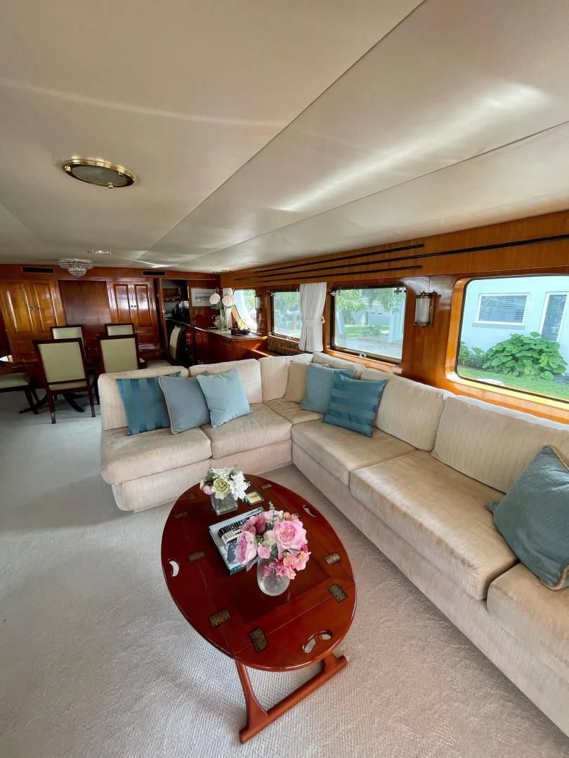 a living room with a couch and a coffee table aboard SEA CZAR Yacht for Sale