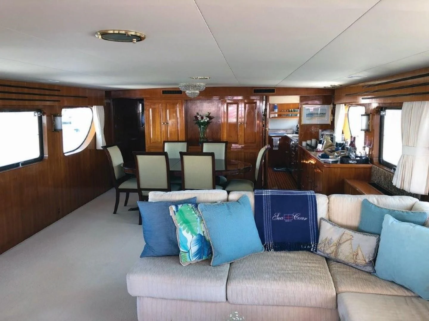 a living room with a couch and a table aboard SEA CZAR Yacht for Sale