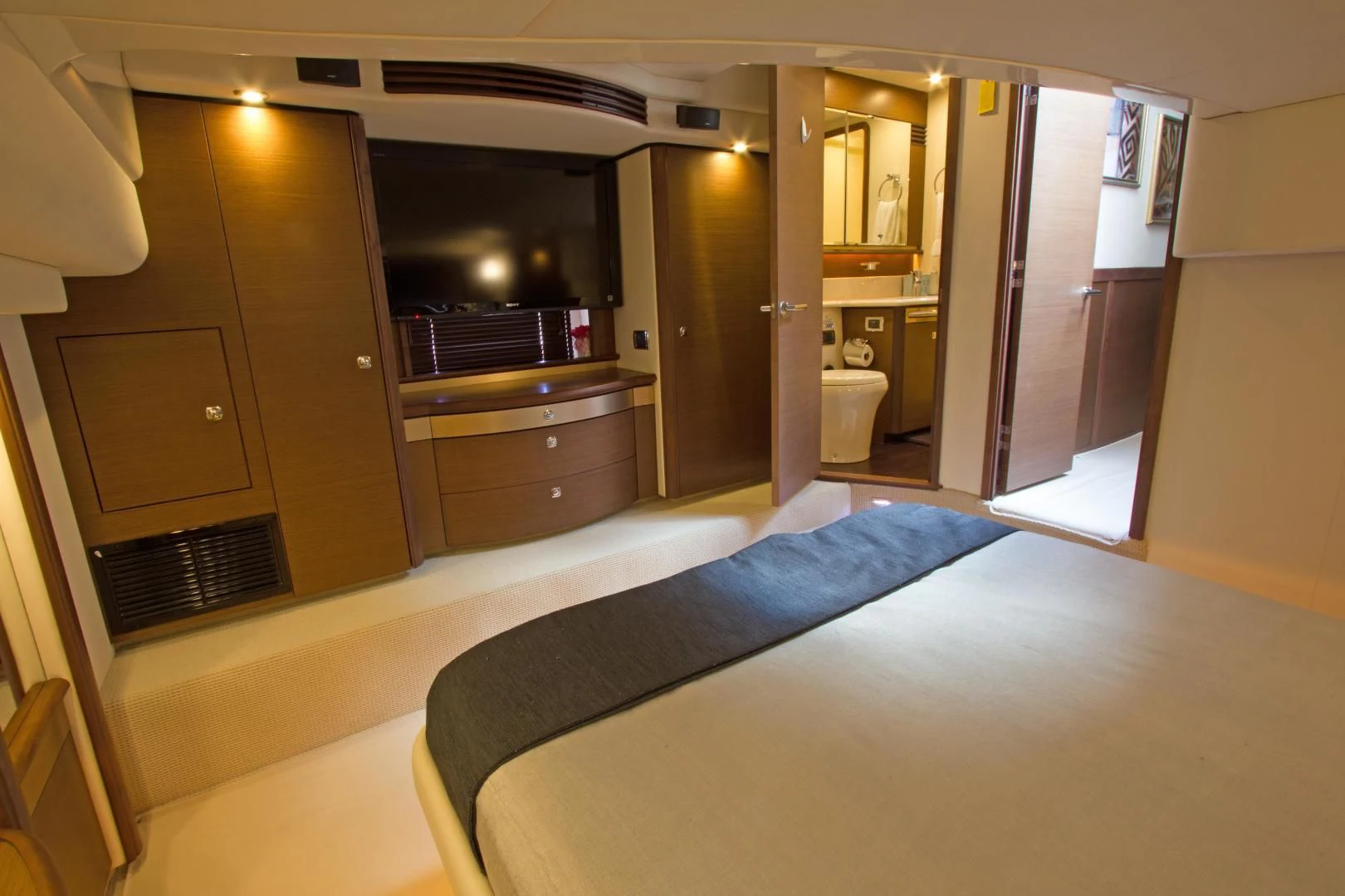 a room with a bed and a desk aboard SEA CZAR Yacht for Sale