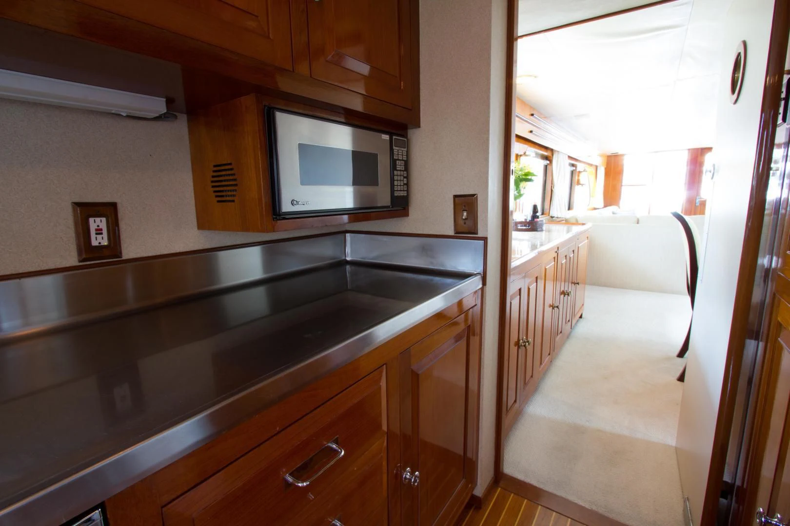 a kitchen with a microwave oven aboard SEA CZAR Yacht for Sale