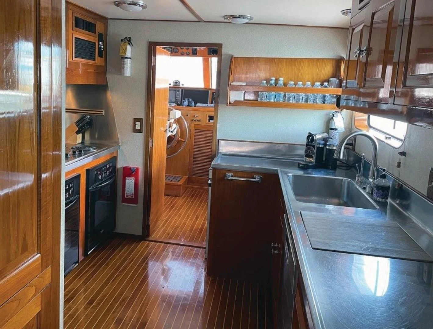 a kitchen with a sink and a stove aboard SEA CZAR Yacht for Sale