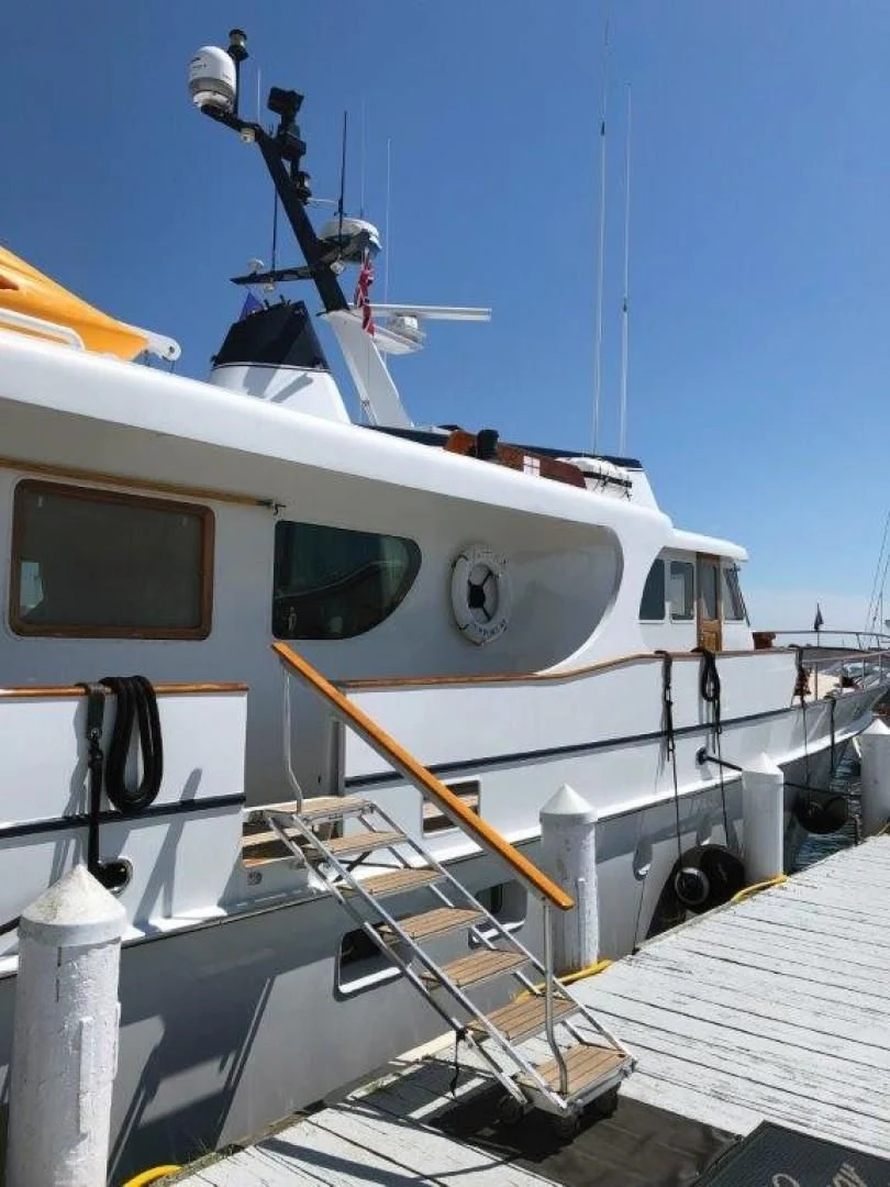 a boat docked at a pier aboard SEA CZAR Yacht for Sale