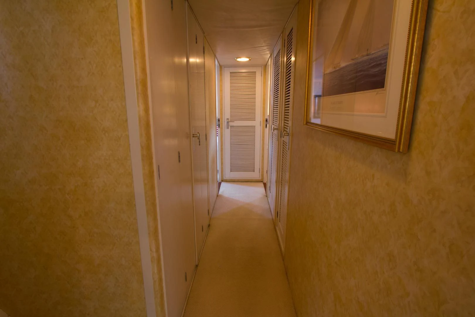 a hallway with doors aboard SEA CZAR Yacht for Sale