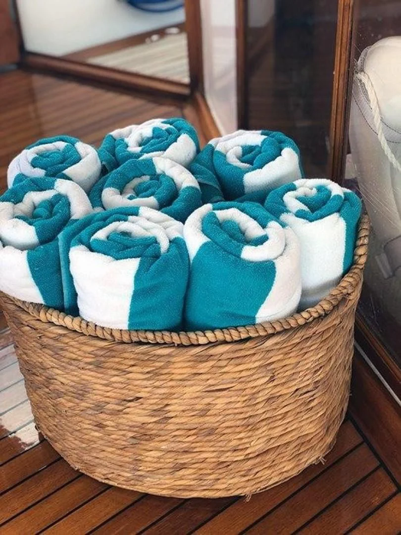 a basket of blue and white towels aboard SEA CZAR Yacht for Sale