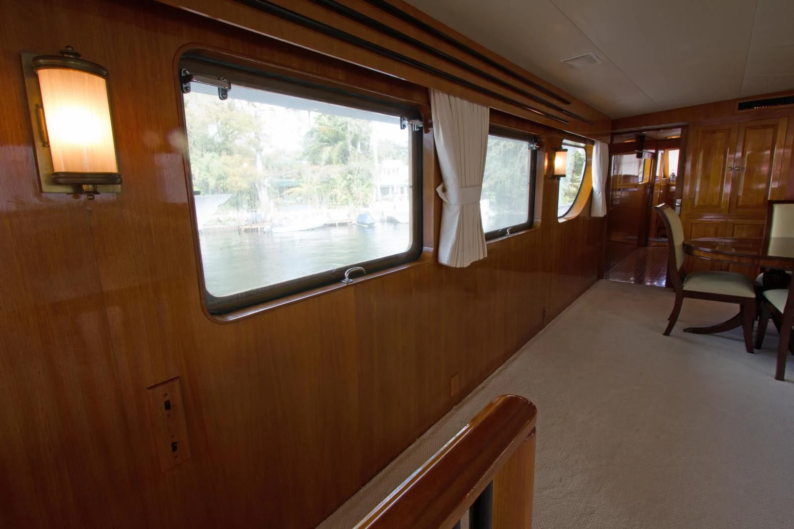 a room with a window and chairs aboard SEA CZAR Yacht for Sale