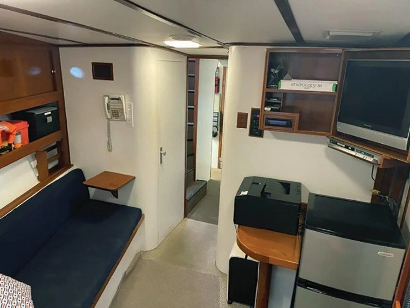 a room with desks and chairs aboard SEA CZAR Yacht for Sale