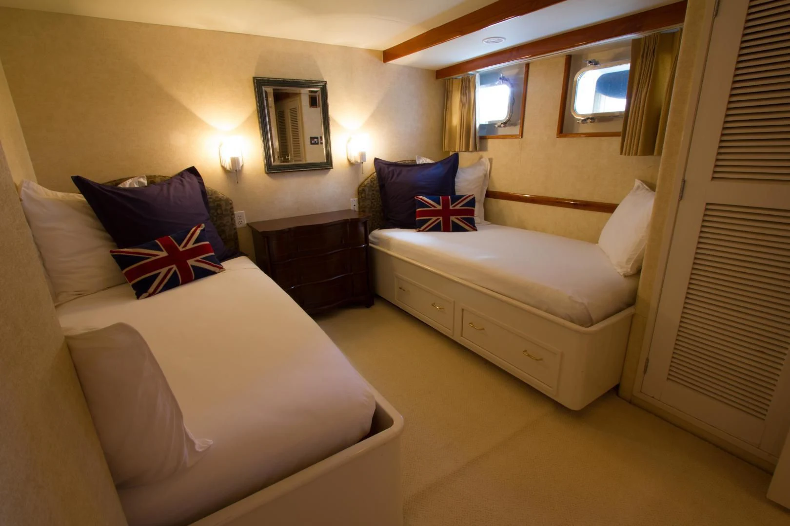 a bedroom with two beds aboard SEA CZAR Yacht for Sale