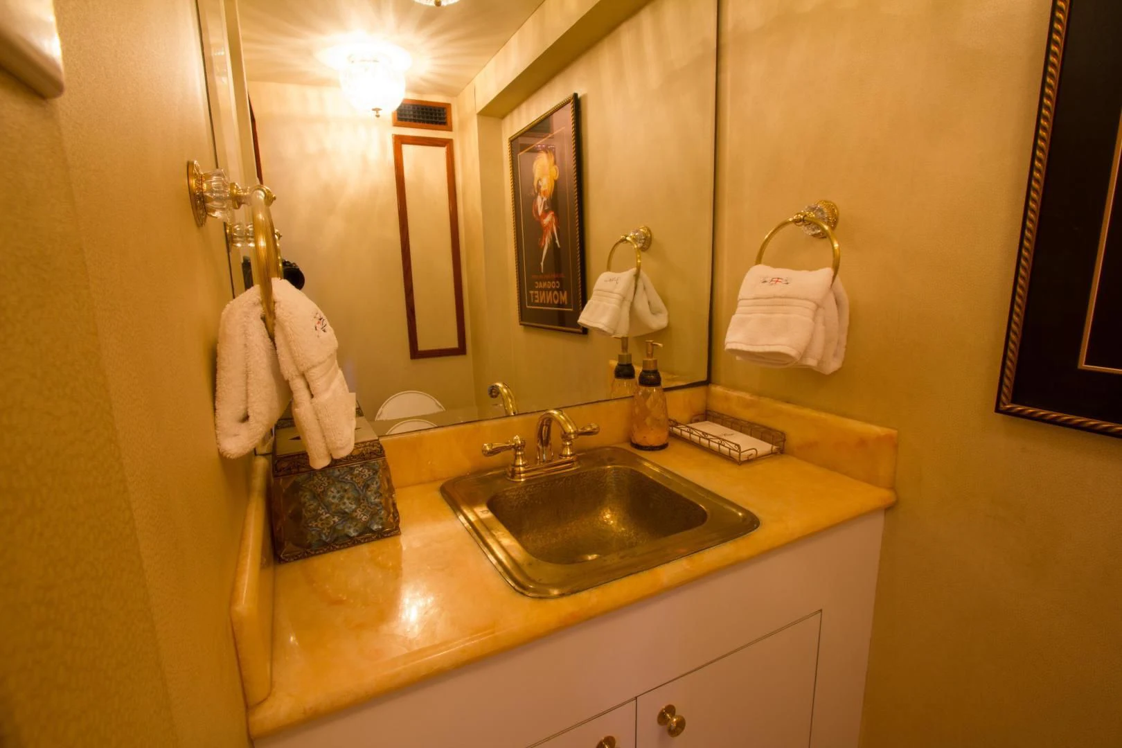 a bathroom with a sink and towels aboard SEA CZAR Yacht for Sale