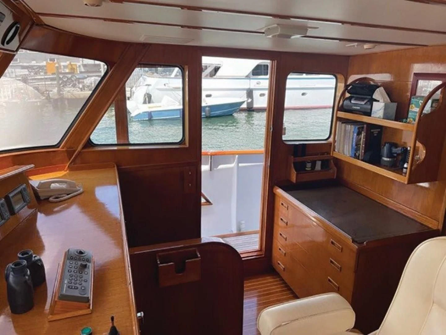 a room with a desk and a window aboard SEA CZAR Yacht for Sale