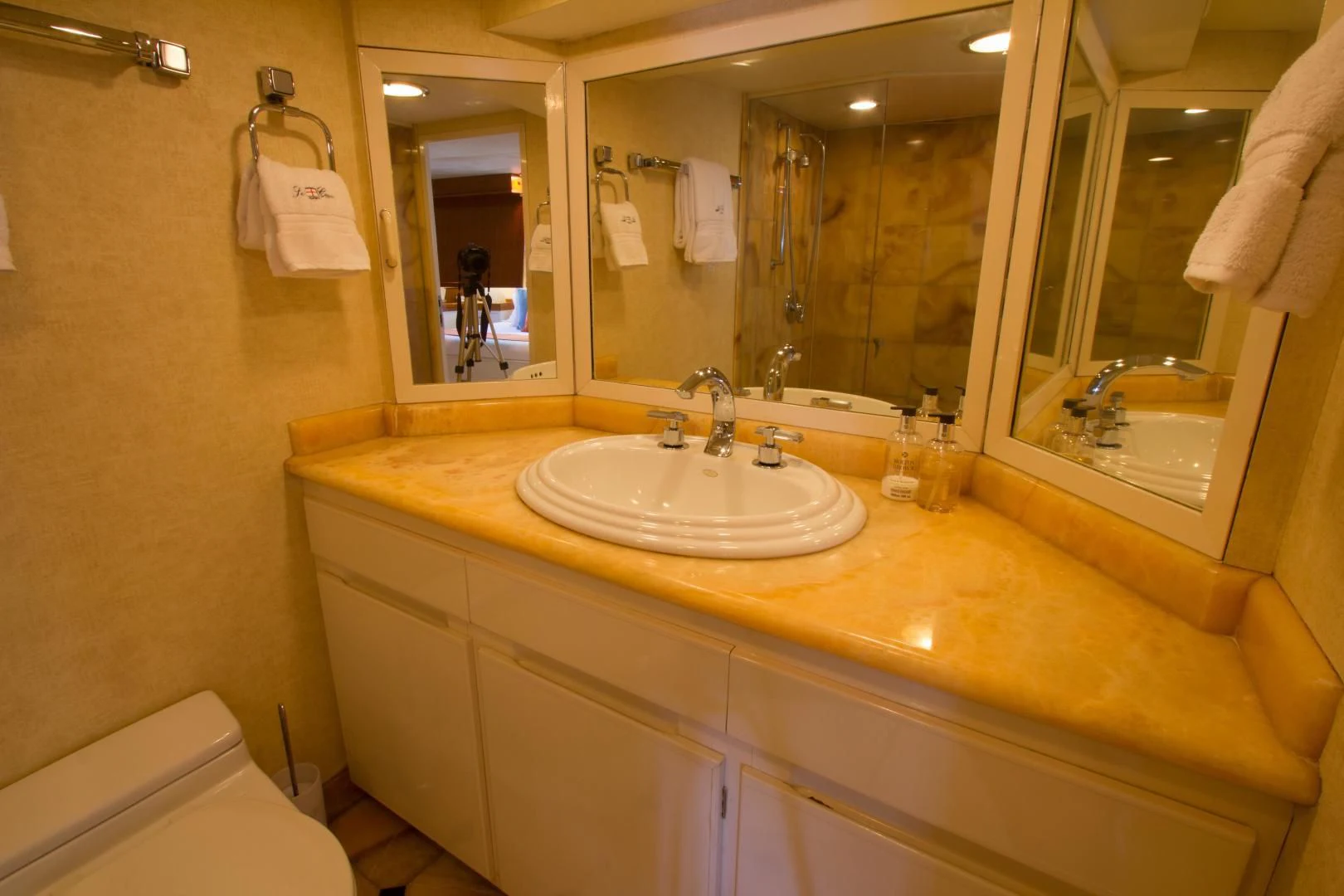 a bathroom with a large mirror aboard SEA CZAR Yacht for Sale