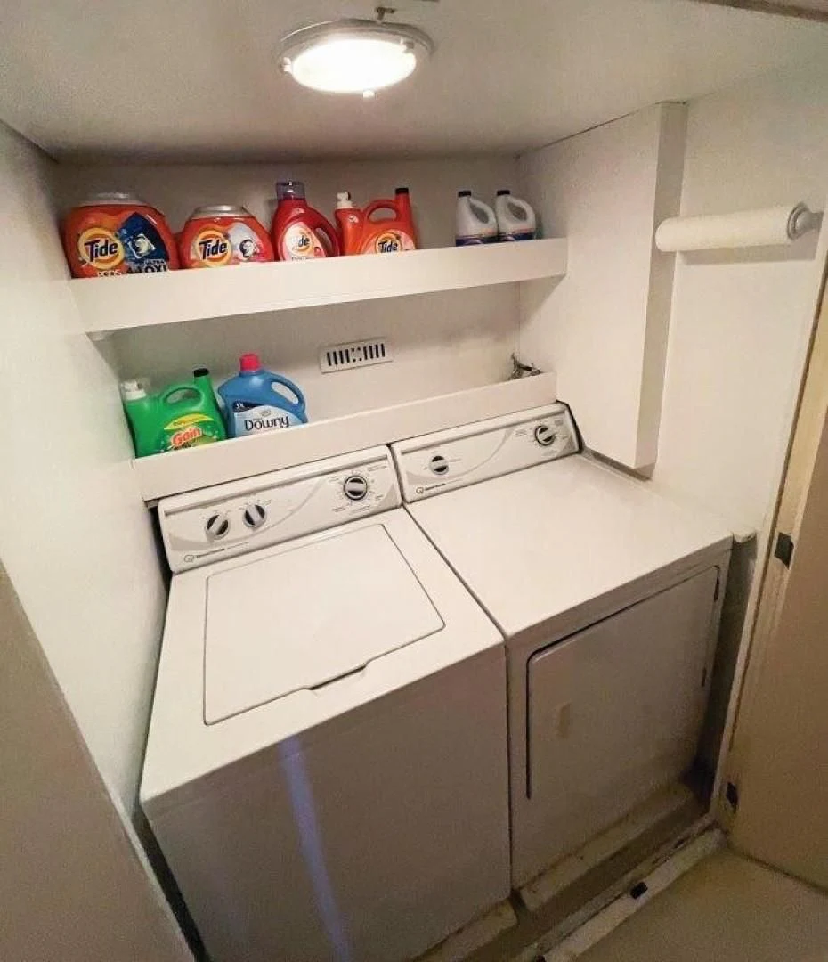 a kitchen with a white cabinet aboard SEA CZAR Yacht for Sale