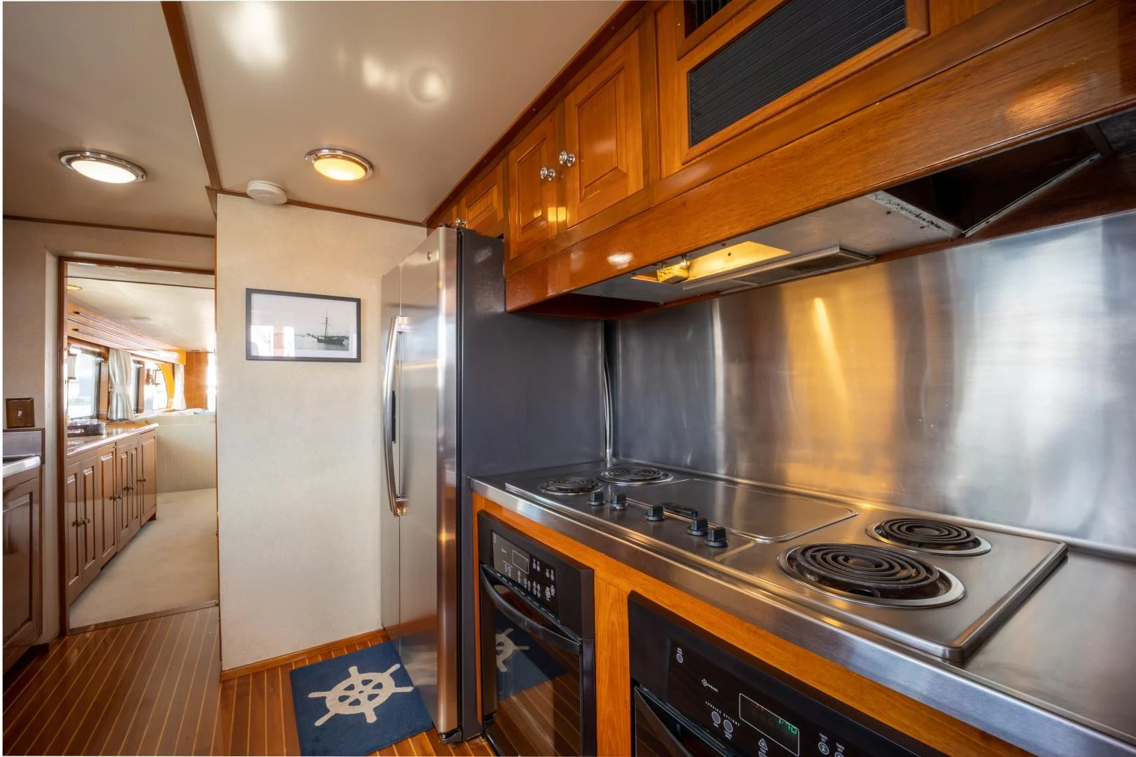a kitchen with a stove and oven aboard SEA CZAR Yacht for Sale