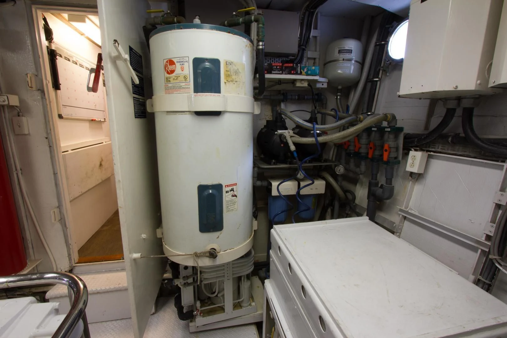 a white machine in a factory aboard SEA CZAR Yacht for Sale