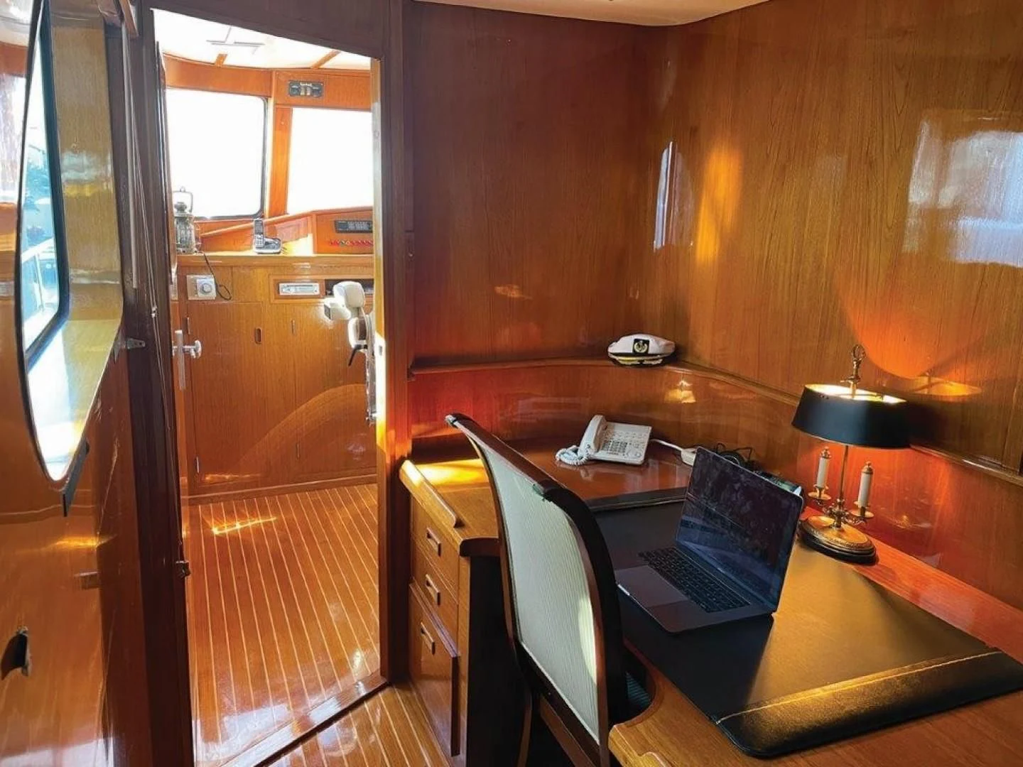 a laptop on a table aboard SEA CZAR Yacht for Sale