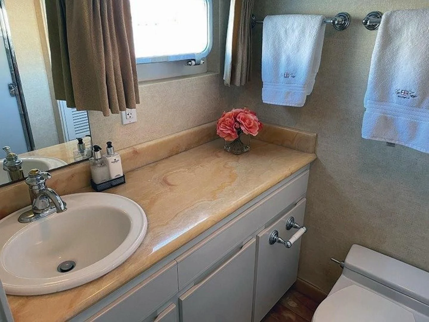 a bathroom with a sink and a mirror aboard SEA CZAR Yacht for Sale