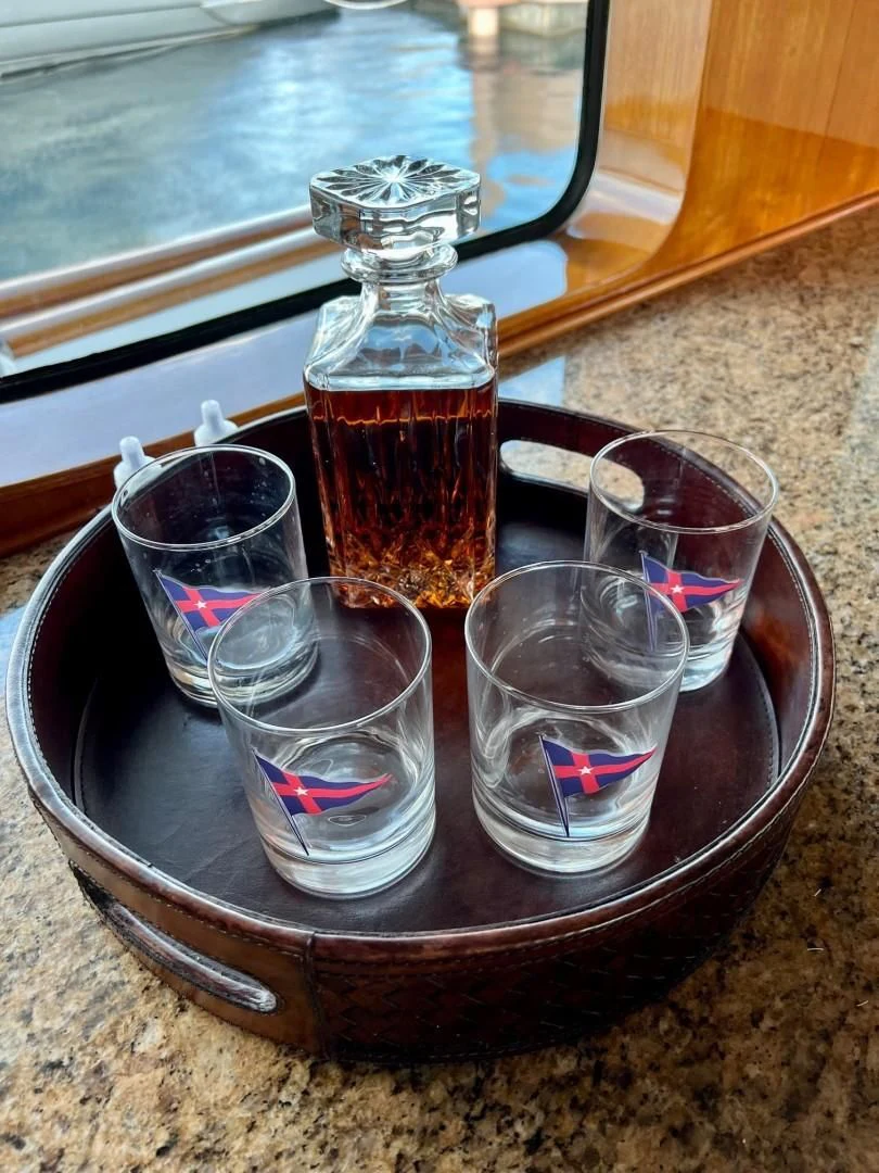 a glass jar and a glass with a drink in it aboard SEA CZAR Yacht for Sale