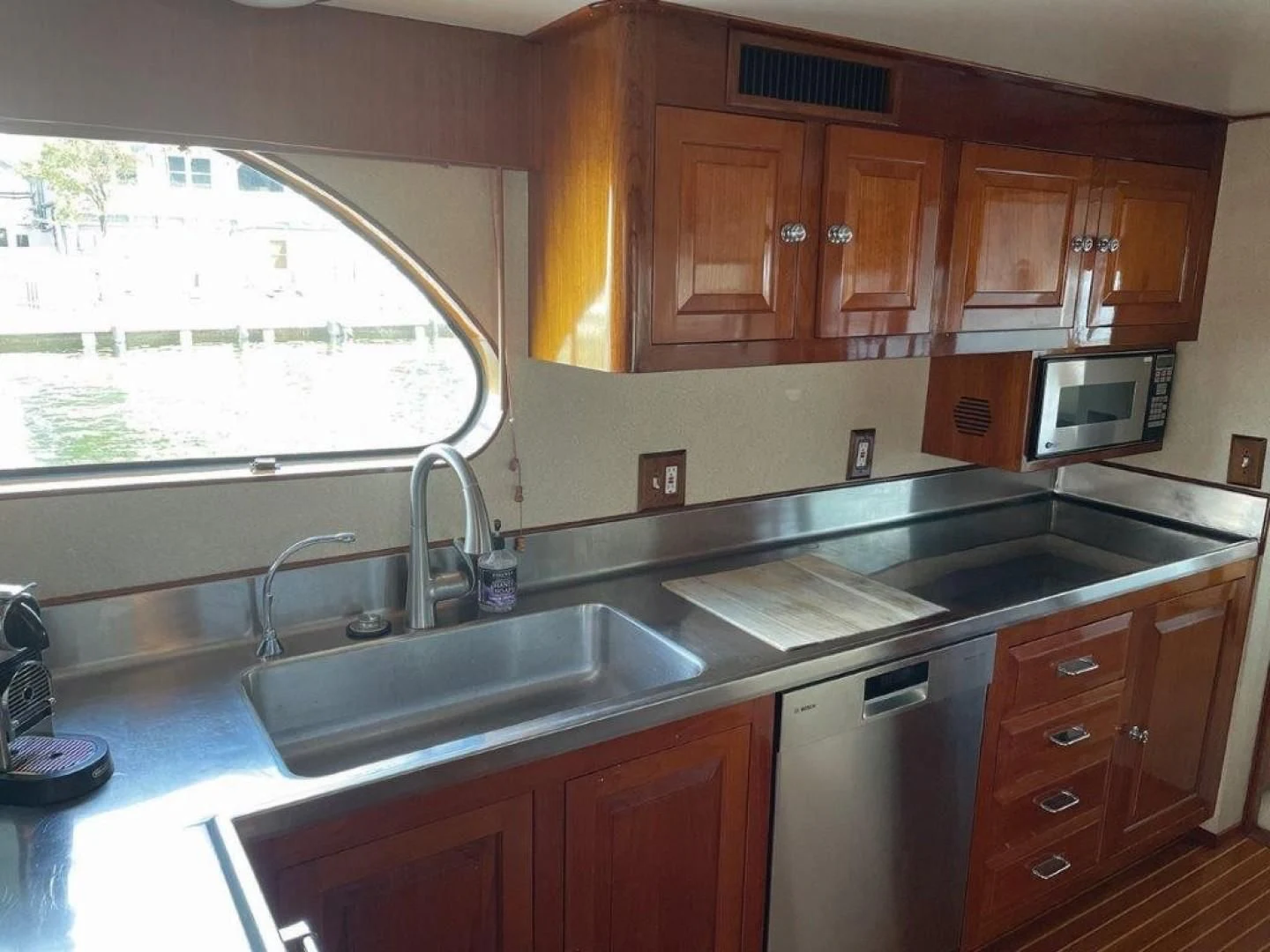 a kitchen with wooden cabinets aboard SEA CZAR Yacht for Sale
