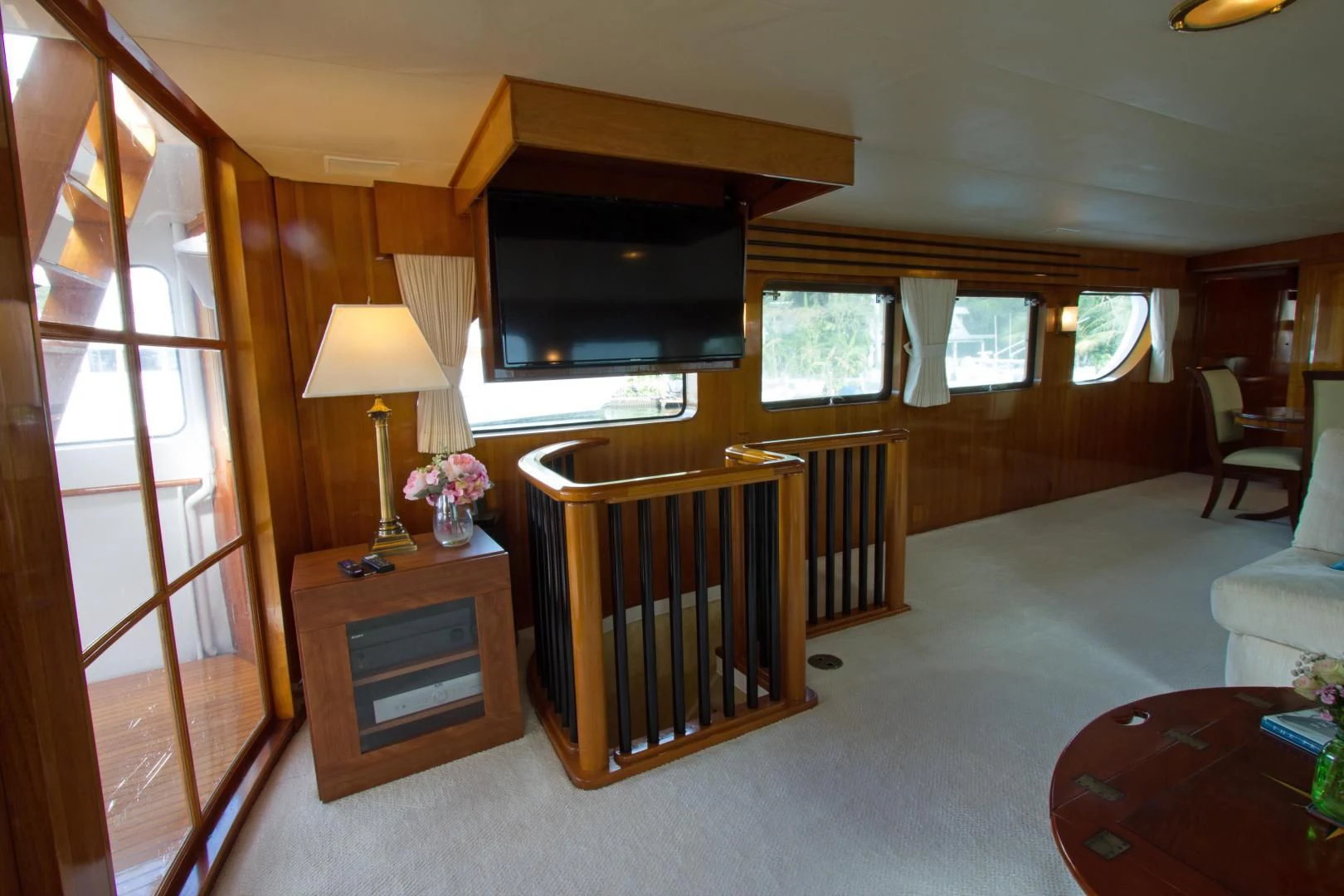 a room with a baby crib and a table and chairs aboard SEA CZAR Yacht for Sale