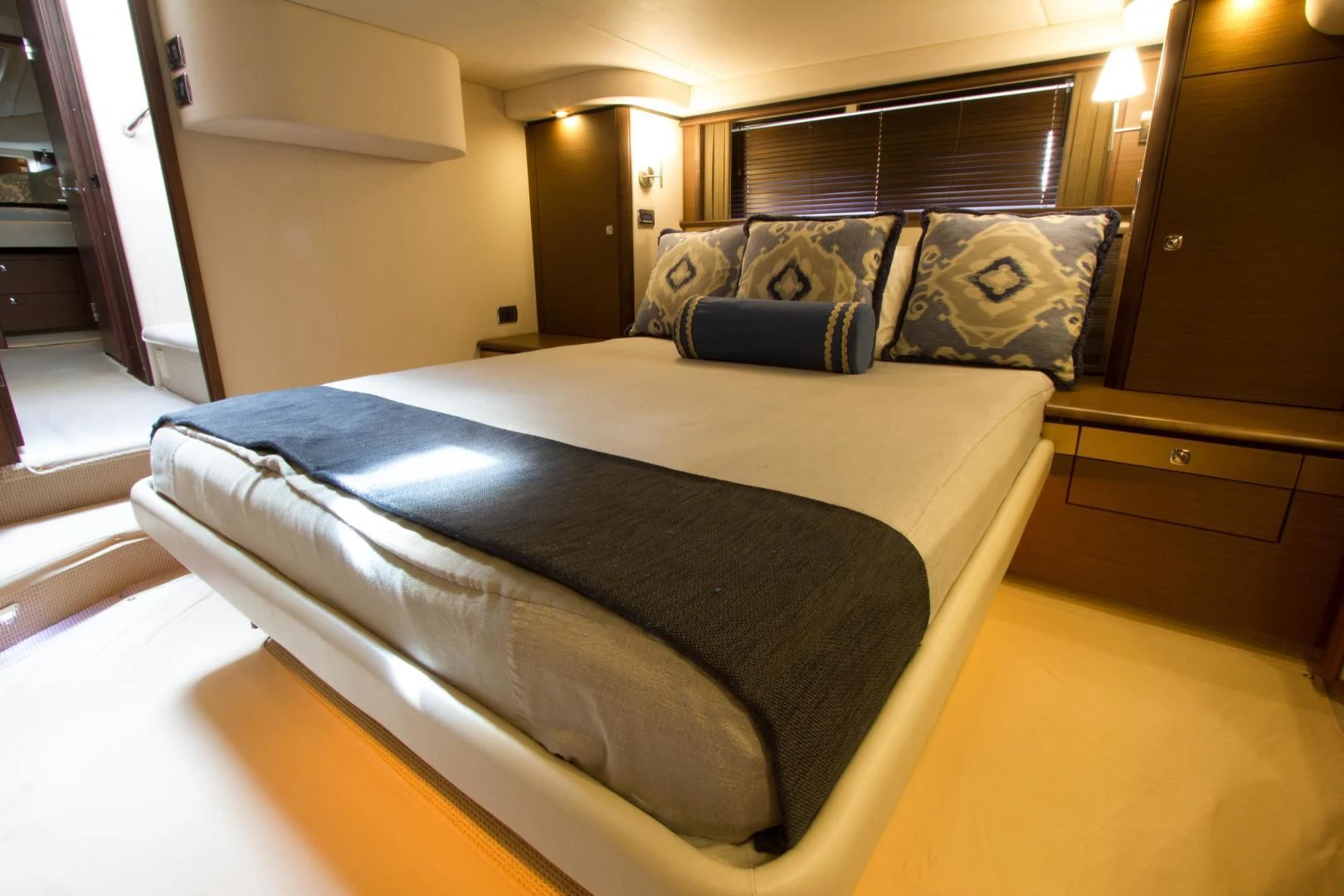 a bed with a black comforter aboard SEA CZAR Yacht for Sale
