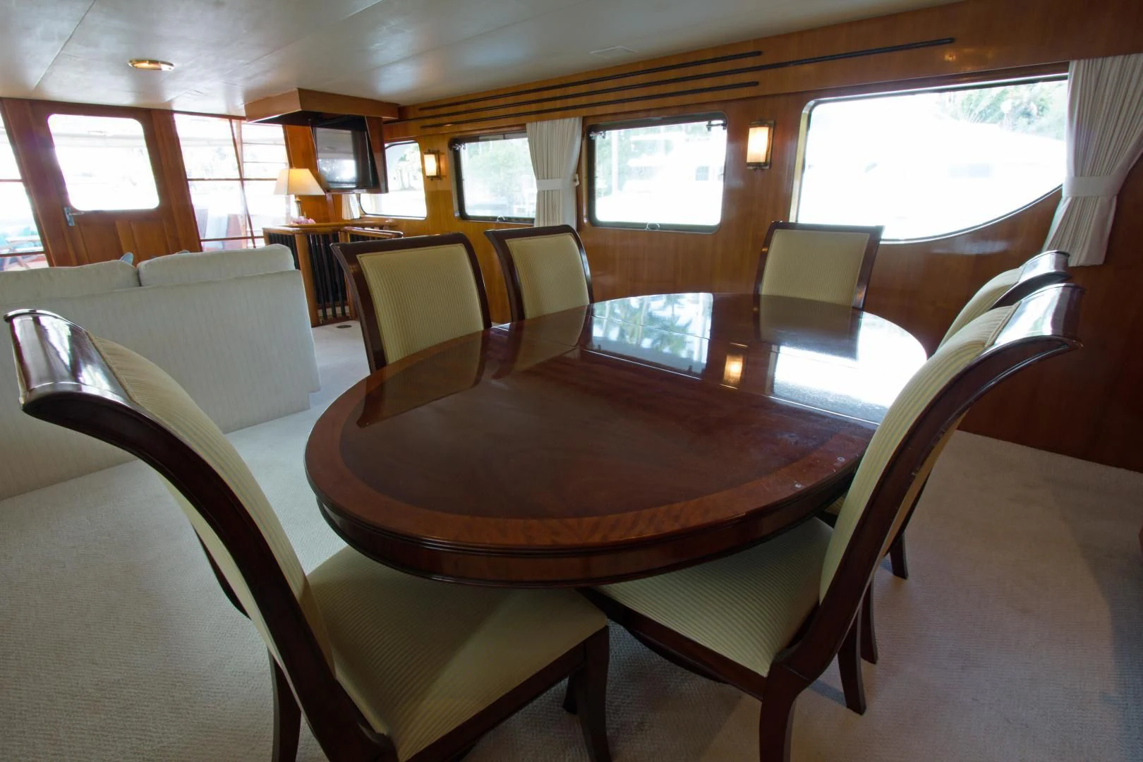 a table with chairs around it aboard SEA CZAR Yacht for Sale