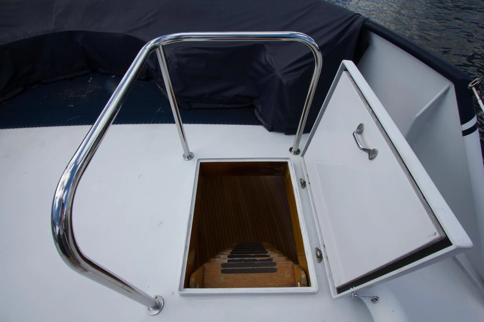a white rectangular object with a black seat and a black seat aboard SEA CZAR Yacht for Sale