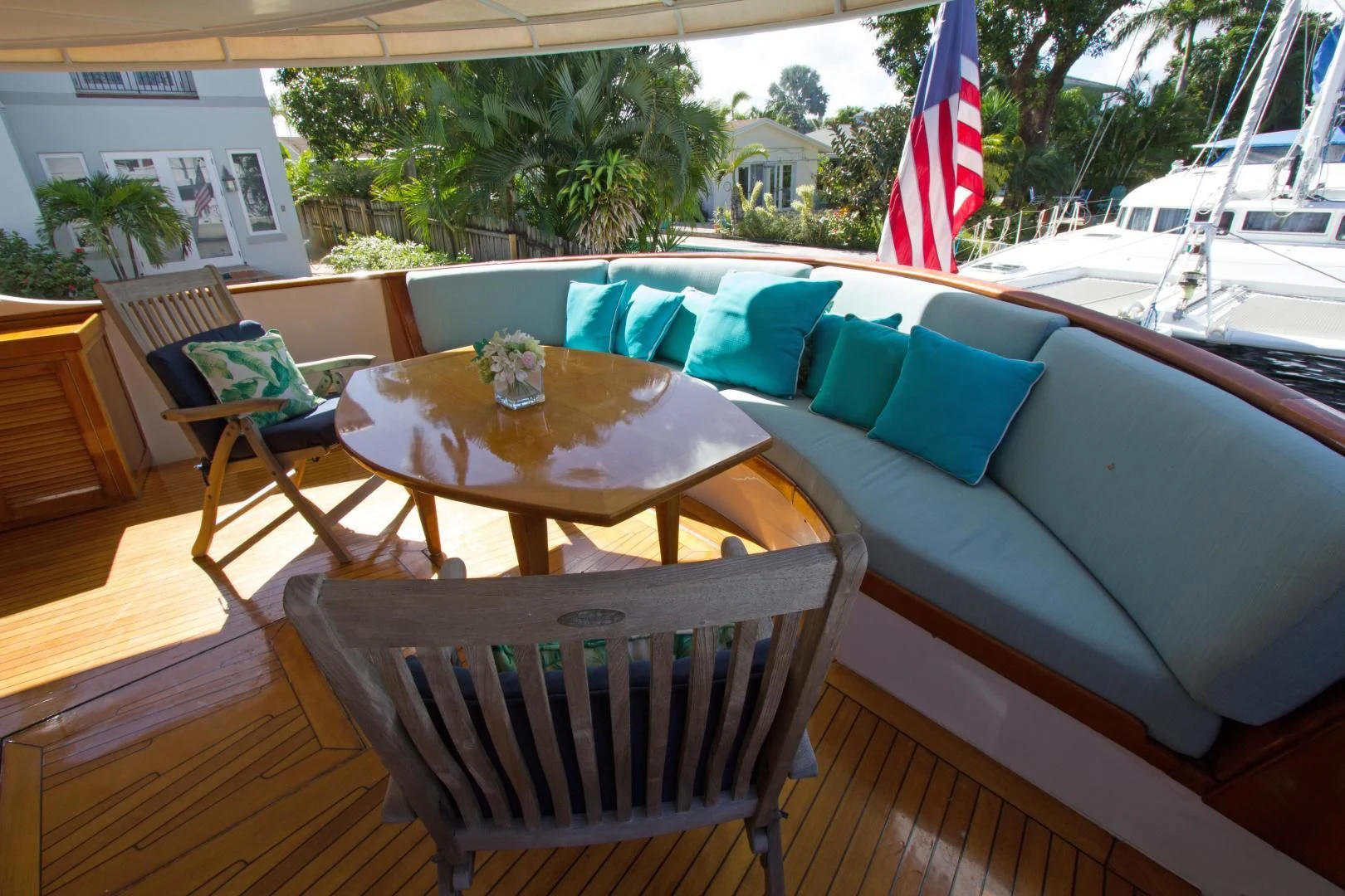 a table and chairs on a deck aboard SEA CZAR Yacht for Sale