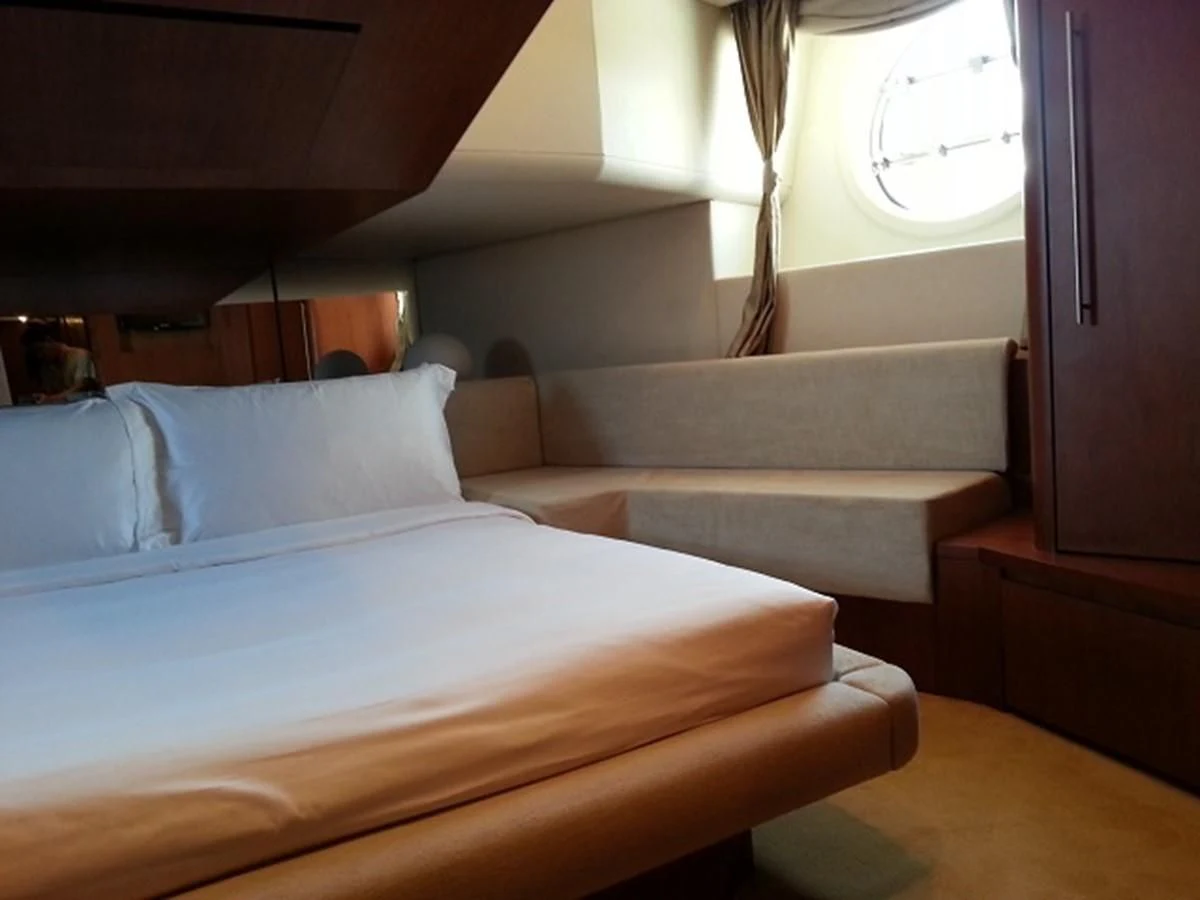 a bed in a room aboard MY JAYA Yacht for Sale