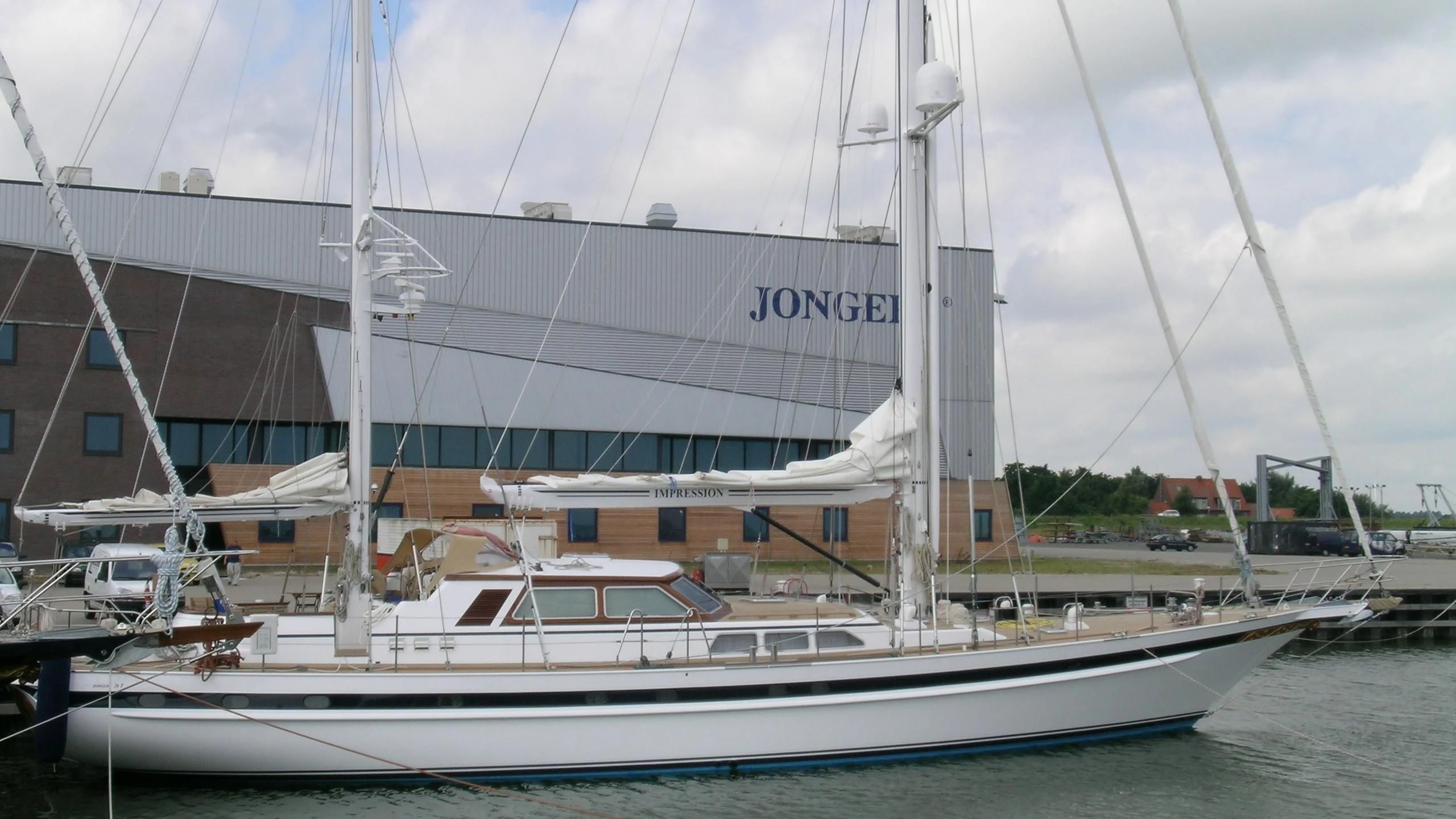 a white boat on the water aboard IMPRESSION Yacht for Sale