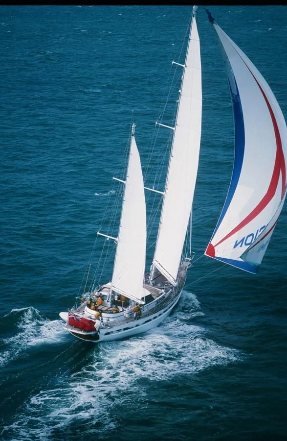 a couple of sailboats on the water aboard IMPRESSION Yacht for Sale