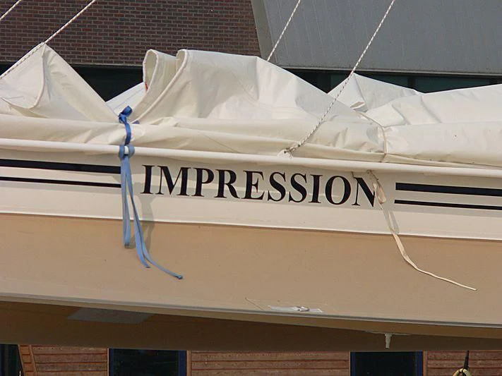 a white sign with blue wires aboard IMPRESSION Yacht for Sale