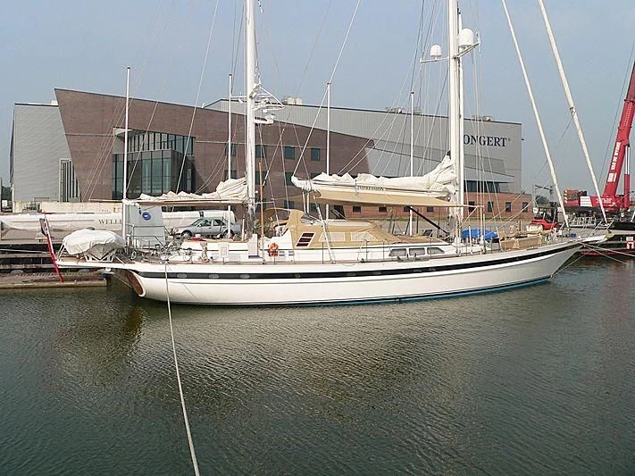a large boat docked in a harbor aboard IMPRESSION Yacht for Sale