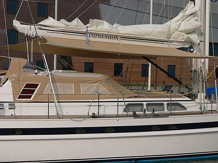 a boat in a harbor aboard IMPRESSION Yacht for Sale